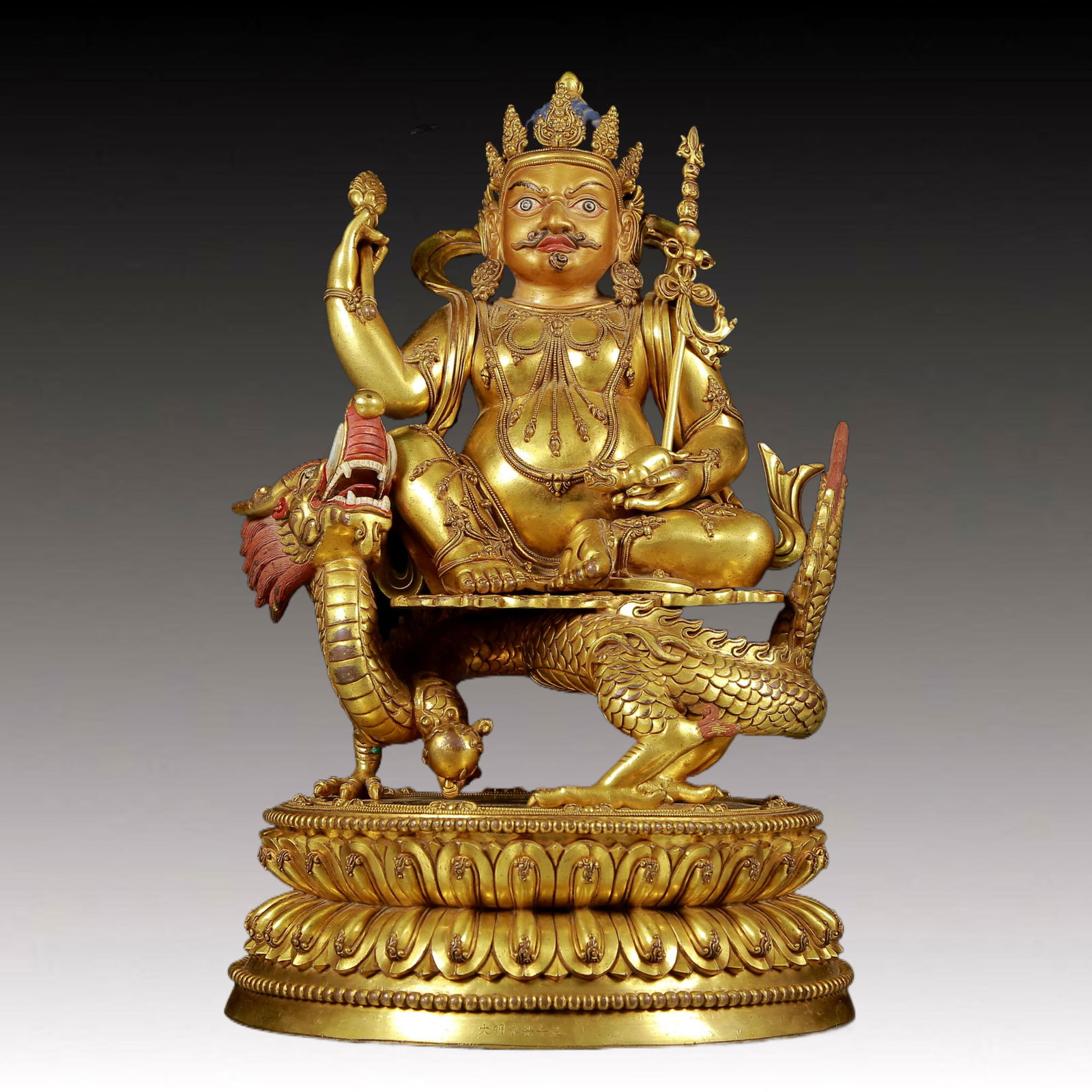 A solemn gilt bronze statue of Mammon: A solemn gilt bronze statue of Mammon, Yongle six-character mark, Ming Dynasty, China. This is a breathtaking piece of Buddhist art. The face of the Buddha statue is solemn and kind, and its eyes are