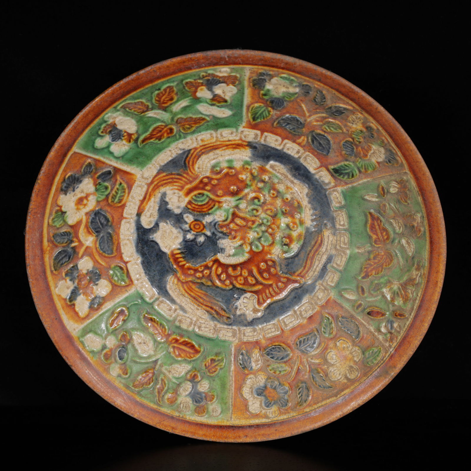 An Exquisite Tang Tri-Color Glazed Pottery Lion Flower Pattern Plate: An Exquisite Tang Tri-Color Glazed Pottery Lion Flower Pattern Plate,Tang Dynasty,China,Size:7.5inx7.5inx1.6in,Weight:450g 