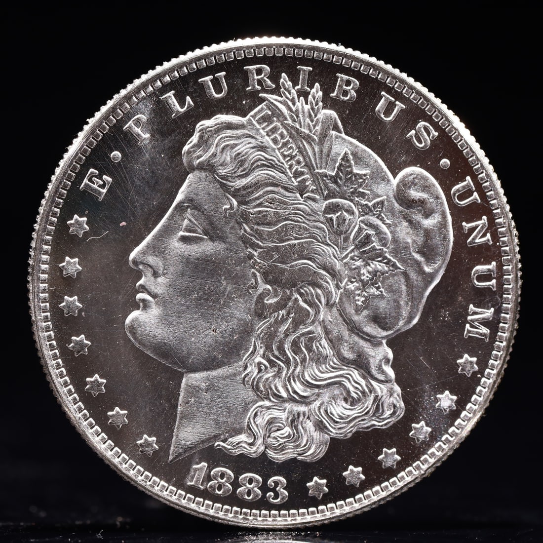 USA Morgan Dollar 1883 Coin: Obv: profile bust with date below and E PLURIBUS UNUM legend and stars around. Rev: eagle with In God we trust above within wreath with UNITED STATES OF AMERICA ONE DOLLAR legend. IN GOD WE TRUST /