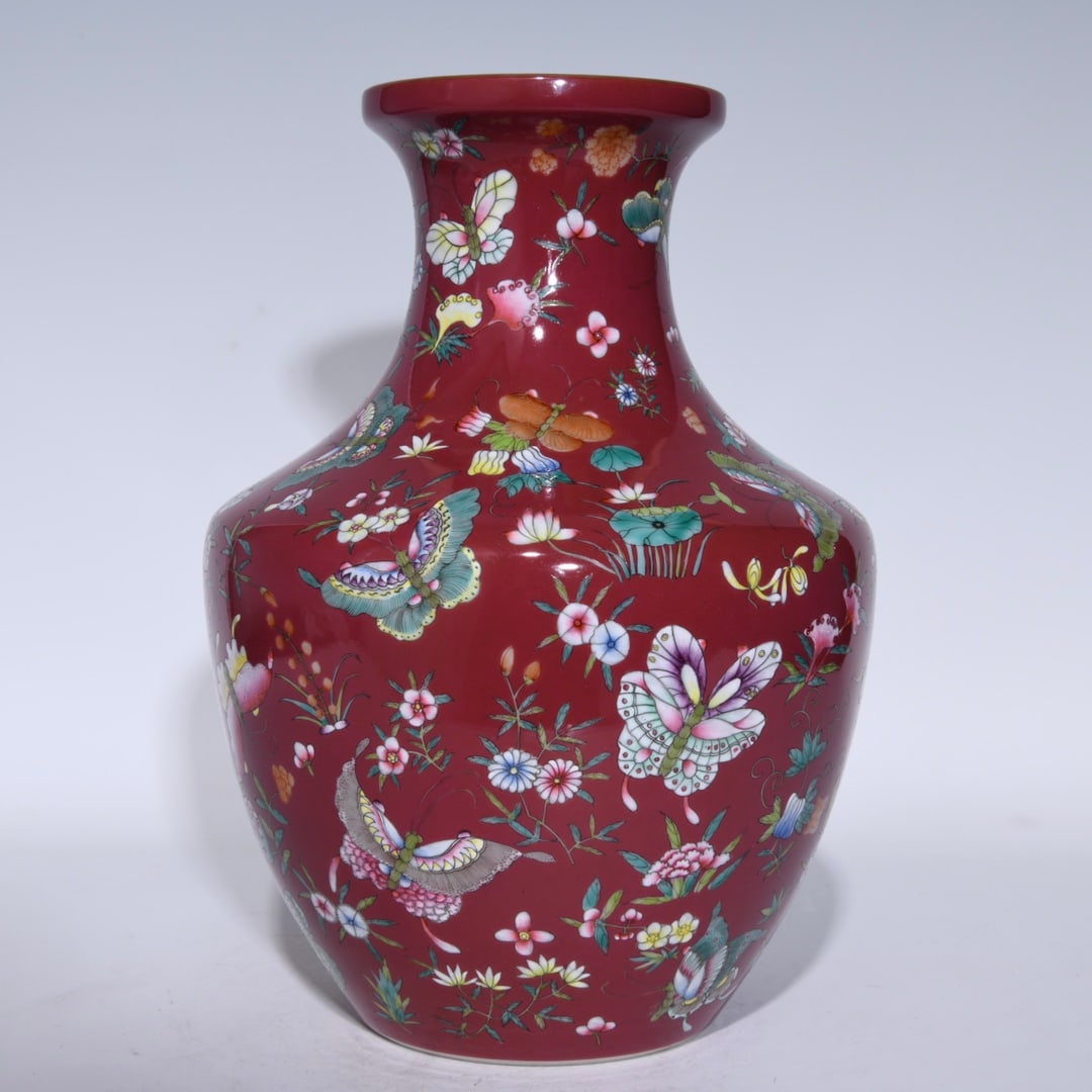 An Exquisite Ruby Red-Glazed Flower and Butterfly Pattern Vase: An Exquisite Ruby Red-Glazed Flower and Butterfly Pattern Vase,Qing Dynasty,China,Yongzheng Six-character Mark,Size:10.8inx8.3in 