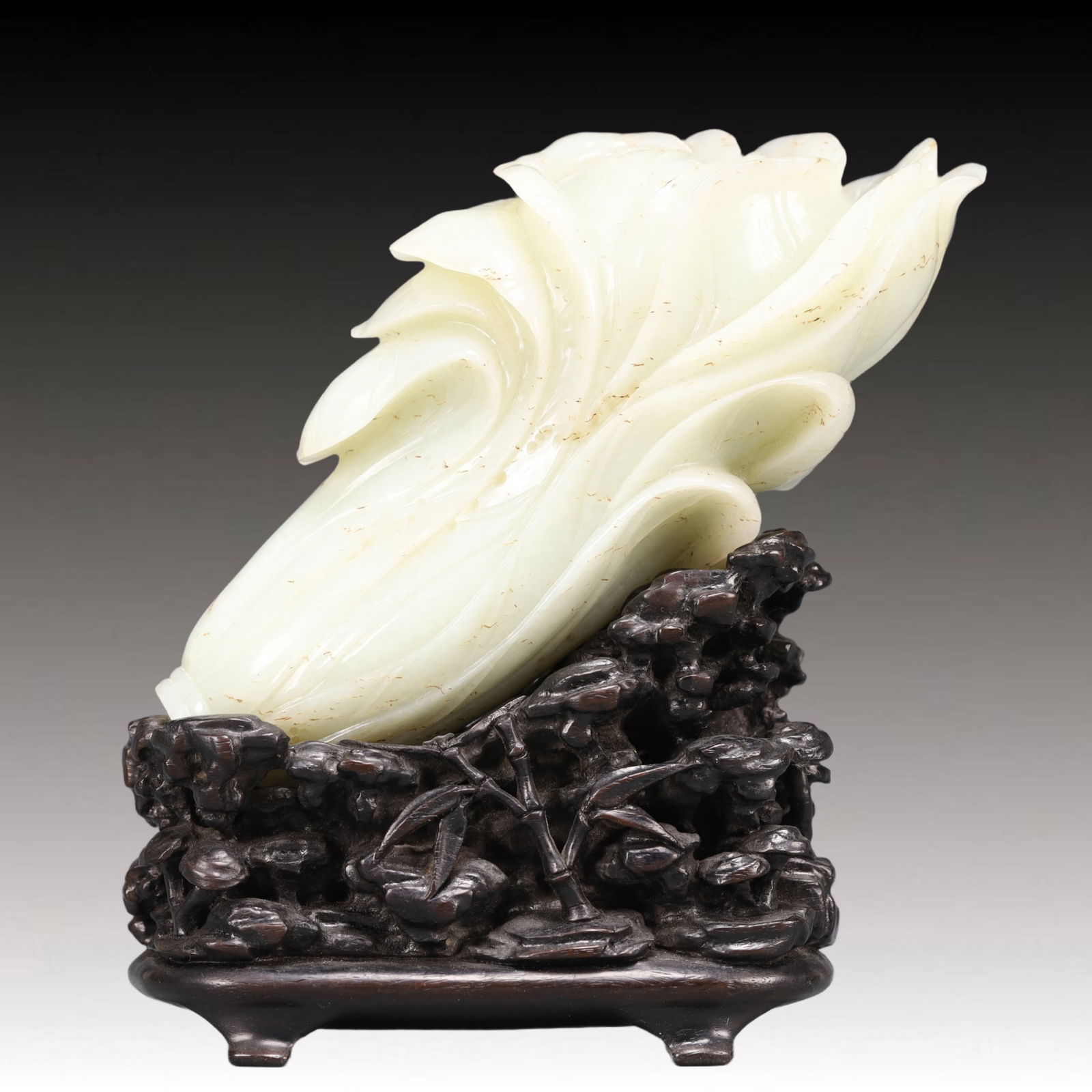 A Precious White Jade Cabbage Ornament: A Precious White Jade Cabbage Ornament,Qing Dynasty, China,Size:4.7inx2.4inx6.3in Weight:1200g 白玉白菜摆件,中国清代