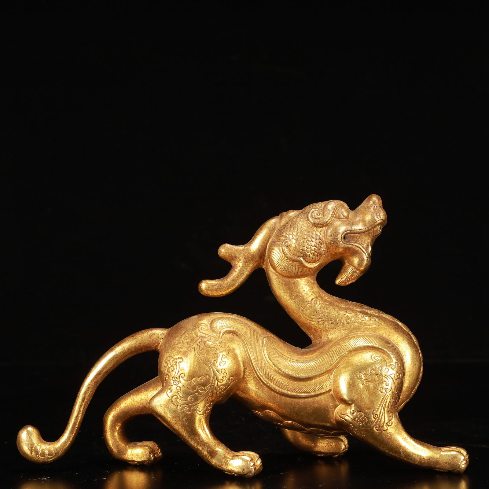 An Exquisite Gilt Bronze Auspicious Beast Ornament: An Exquisite Gilt Bronze Auspicious Beast Ornament,Qing Dynasty, China,Size:2.8inx9.8inx6.3in,Weight:900g 铜鎏金瑞兽摆件,中国清代