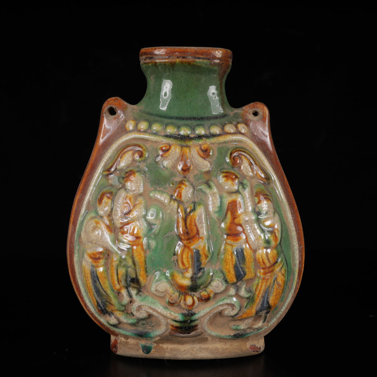 An Exquisite Tang Tri-Color Glazed Pottery Figure Pattern teapot: An Exquisite Tang Tri-Color Glazed Pottery Figure Pattern teapot,Tang Dynasty,China,Size:6.7inx5.1inx3.1in,Weight:550g 唐三彩人物纹壶,中国唐