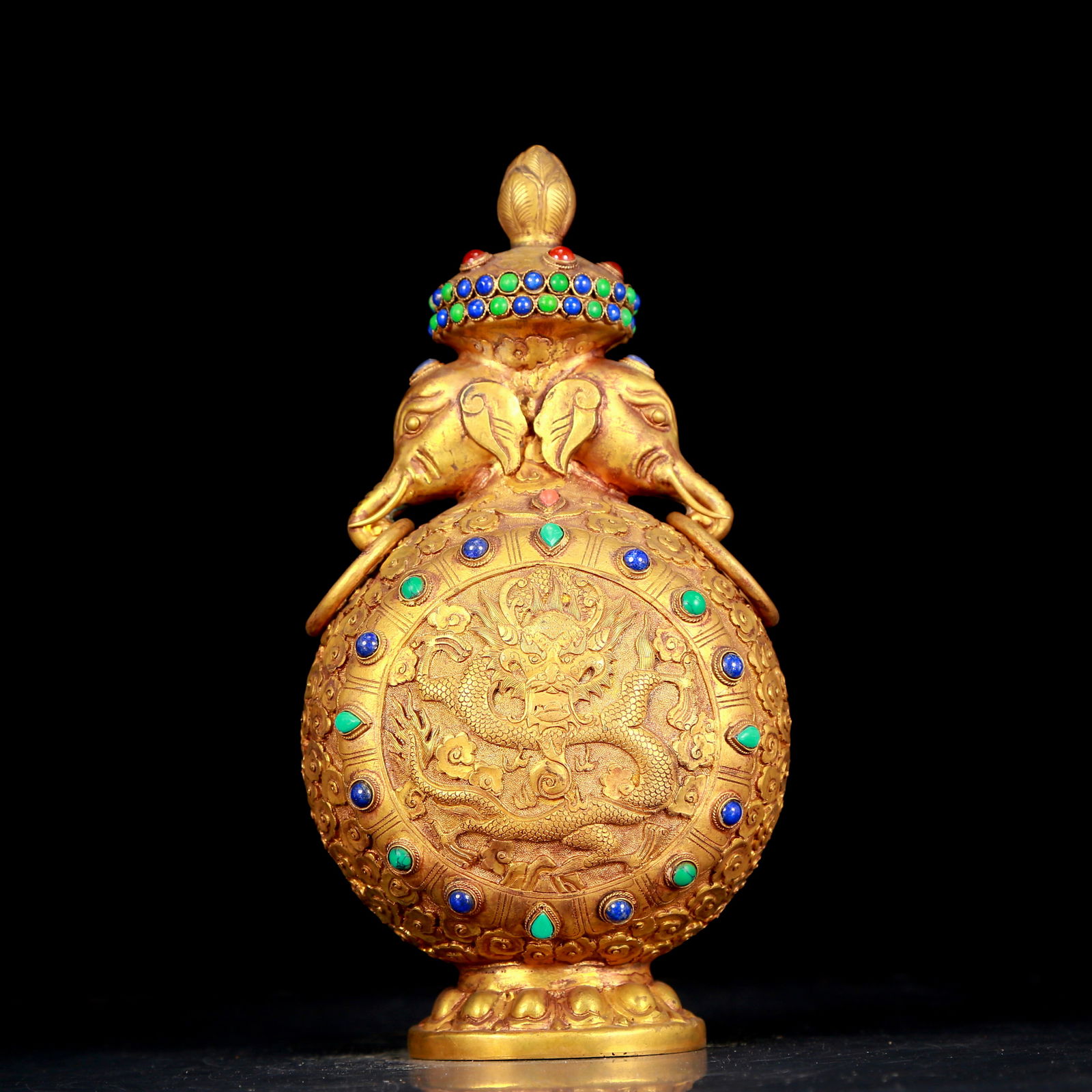 An exquisite gilt bronze elephant-ear vase inlaid with gems and dragon pattern: An exquisite gilt bronze and gem-inlaid dragon-pattern elephant-ear vase, Qing Dynasty, China. The surface has been carefully carved, vividly demonstrating the superb skills of the craftsmen. It has i