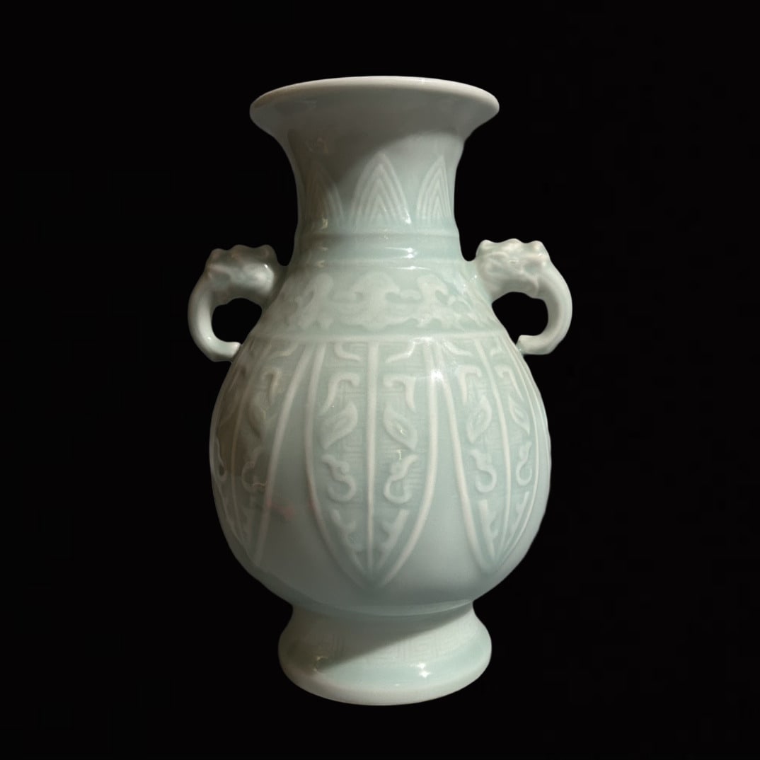 An Exquisite Celadon Glazed Beast-Face Pattern Elephant-Ears Vase: An Exquisite Celadon Glazed Beast-Face Pattern Elephant-Ears Vase,Qing Dynasty,China,Qianlong Six-character Mark,Size:5.7inx9.1in