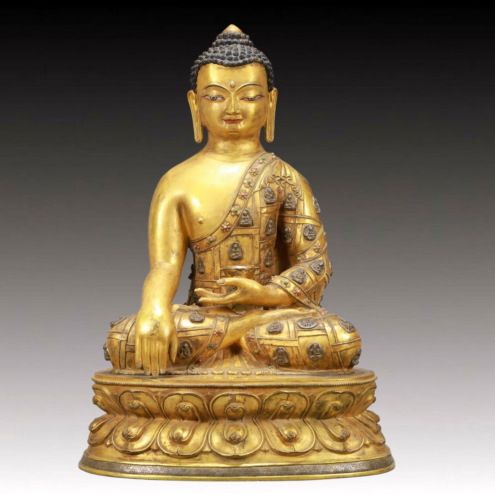 A Solemn Gilt Bronze Statue of Sakyamuni: A Solemn Gilt Bronze Statue of Sakyamuni,Ming Dynasty, China,Size:16.3inx9.8inx24.6in,Weight:22450g 