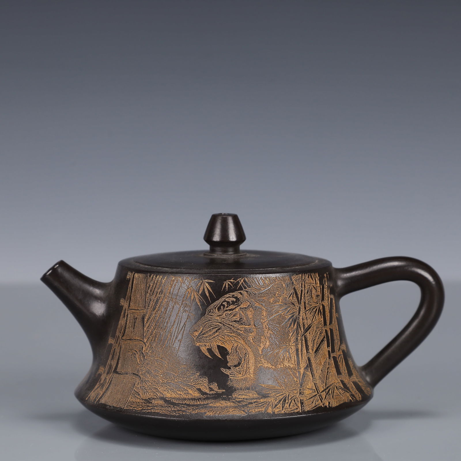 An Exquisite Purple Sands Tiger and Bamboo Pattern Teapot: An Exquisite Purple Sands Tiger and Bamboo Pattern Teapot,Qing Dynasty, China,With Mark,Size:5.9inx46.5in,Weight:237g 