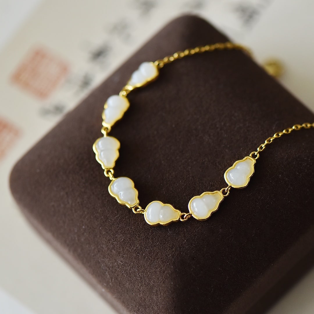 An Exquisite Sterling Silver-Gold Plated Inlaid White Jade Bracelet: An Exquisite Sterling Silver-Gold Plated Inlaid White Jade Bracelet,Size:0.2inx0.3in 纯银镀金镶白玉手链