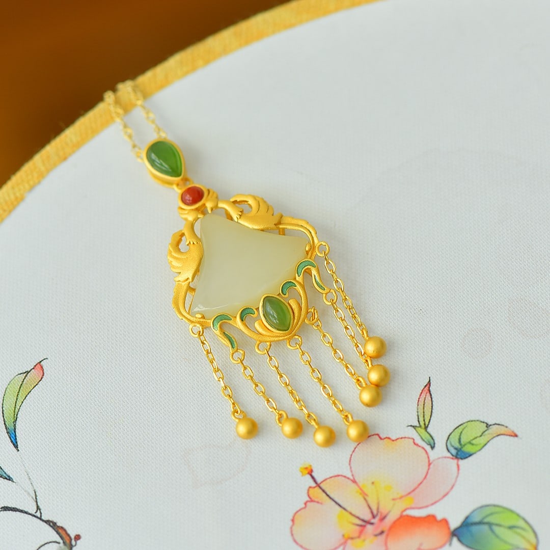 An Exquisite Sterling Silver-Gold Plated Inlaid White Jade Pendant: An Exquisite Sterling Silver-Gold Plated Inlaid White Jade Pendant,Size:0.6inx0.8in 纯银镀金镶白玉吊坠