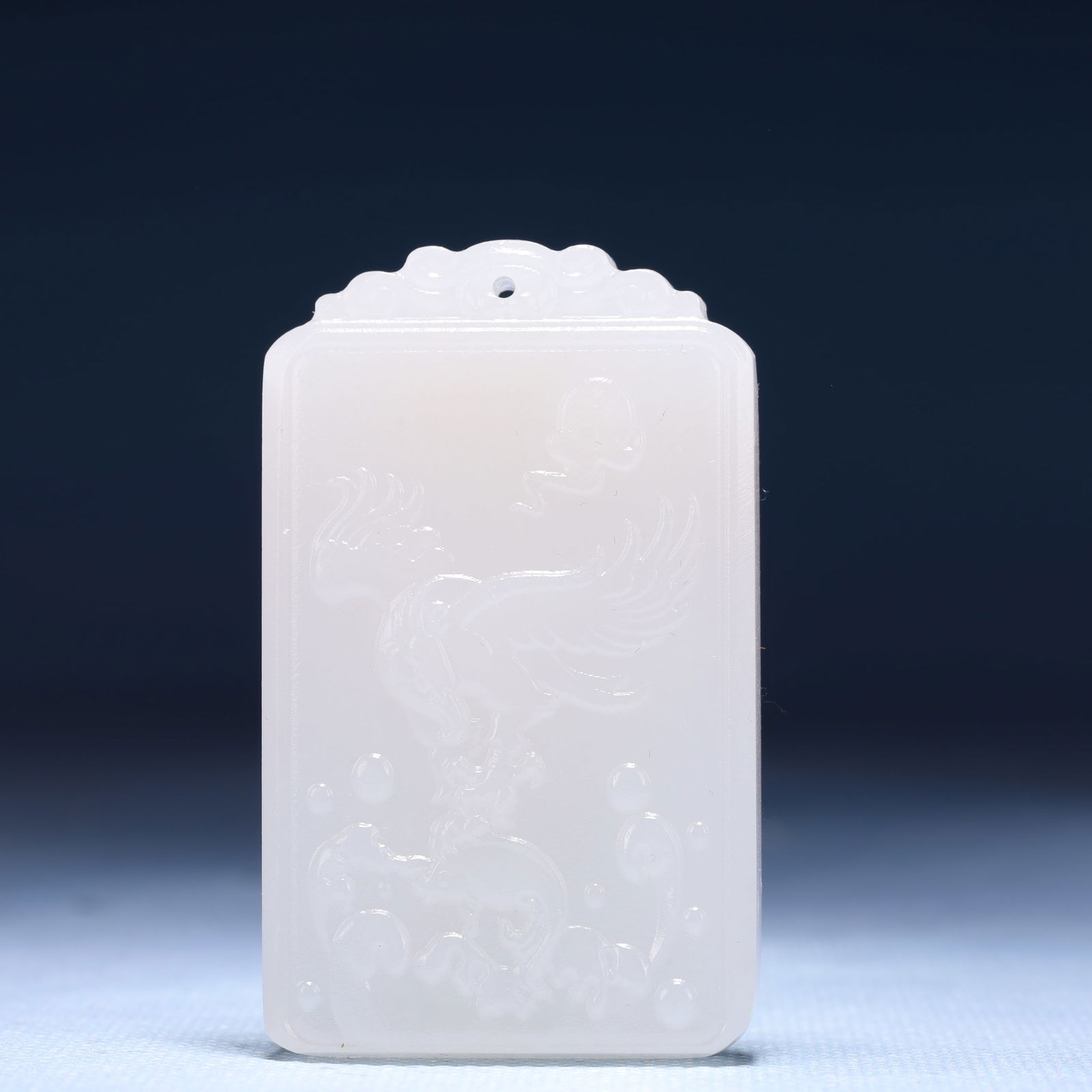 An Exquisite White Jade Flower and Phoenix Pattern Pendant: An Exquisite White Jade Flower and Phoenix Pattern Pendant,Size:1.6inx0.4inx2.4in,Weight:53g 白玉花卉凤纹牌