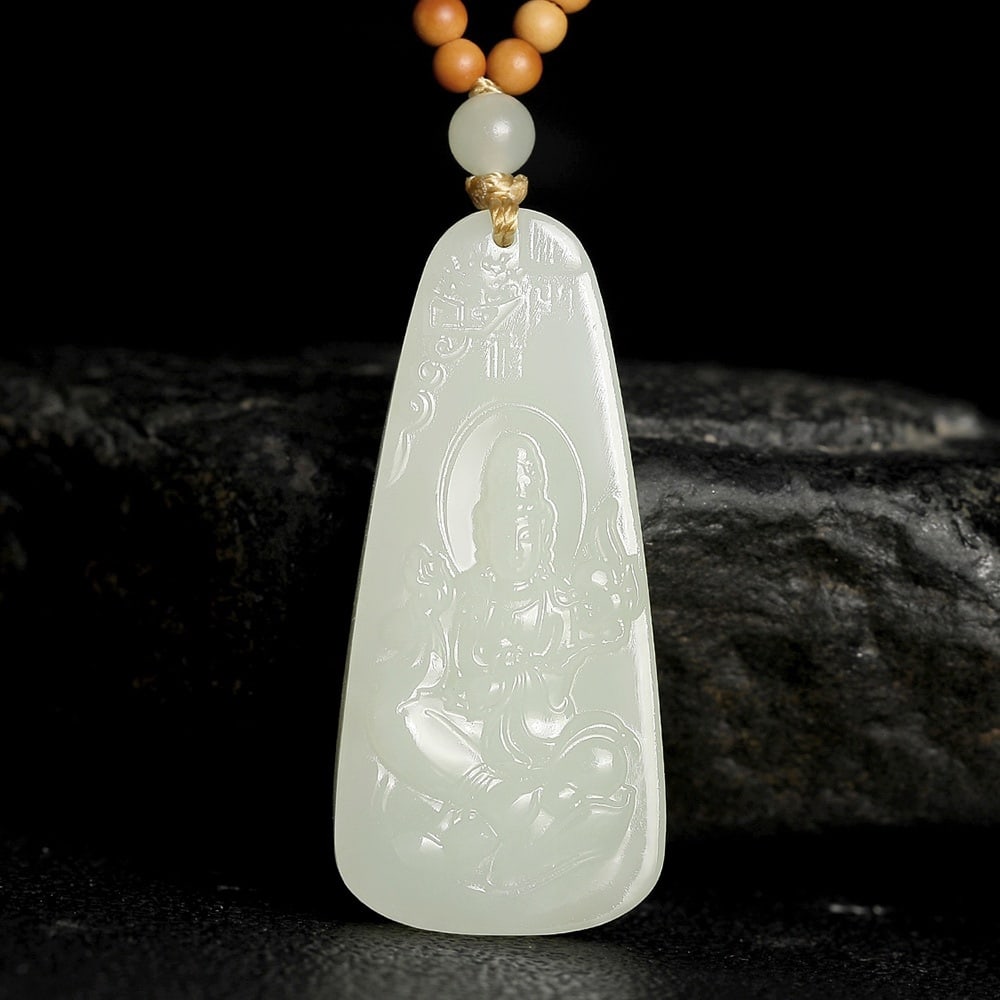 An Exquisite White Jade Statue of Avalokitesvara Pendant: An Exquisite White Jade Statue of Avalokitesvara Pendant,Size:2inx0.9inx0.3in 白玉观音像挂件