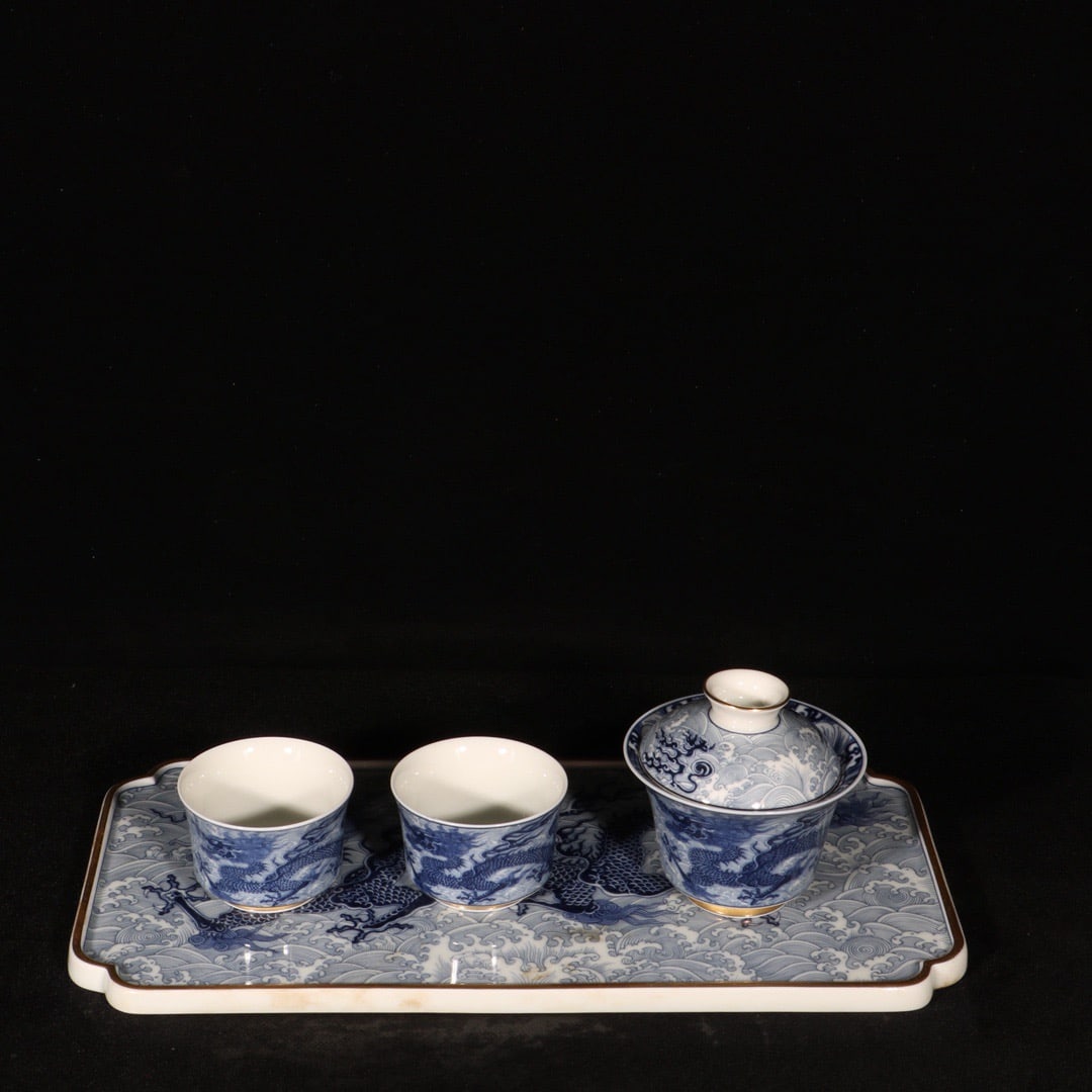 A Set of Fine Blue and White Painted Gold Seawater and Dragon Pattern Tea Sets: A Set of Fine Blue and White Painted Gold Seawater and Dragon Pattern Tea Sets,Qing Dynasty,China,Qianlong Six-character Mark,Size:(Plate)6.3inx12.6in,(Bowl)3.3inx3.5in 一套青花