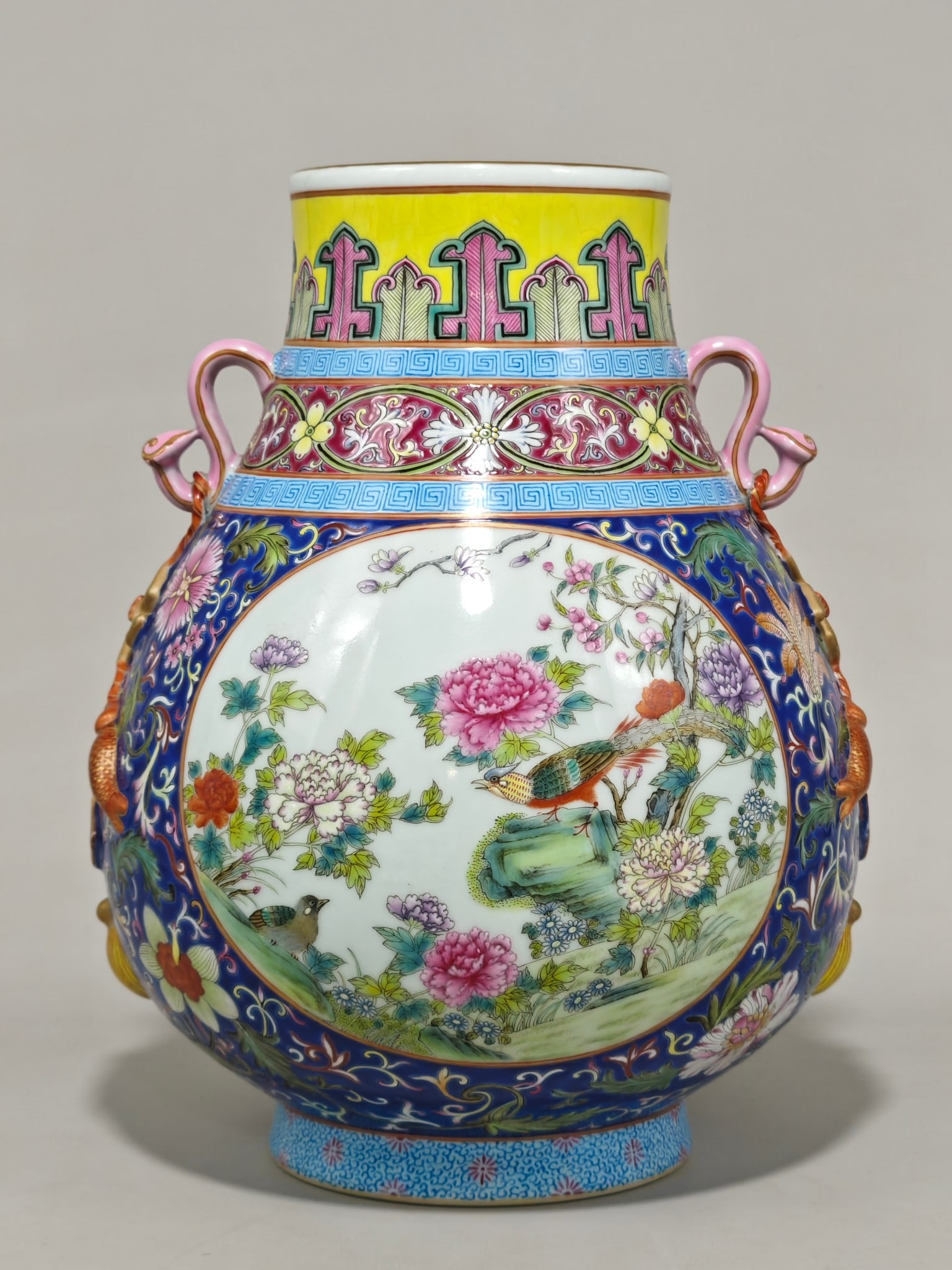 An Exquisite Famille-Rose Sapphire Blue Glazed Flower and Bird Pattern Double-Ears Jar: An Exquisite Famille-Rose Sapphire Blue Glazed Flower and Bird Pattern Double-Ears Jar,Qing Dynasty,China,Qianlong Six-character Mark,Size:11.2inx8.7in 粉彩宝石蓝釉
