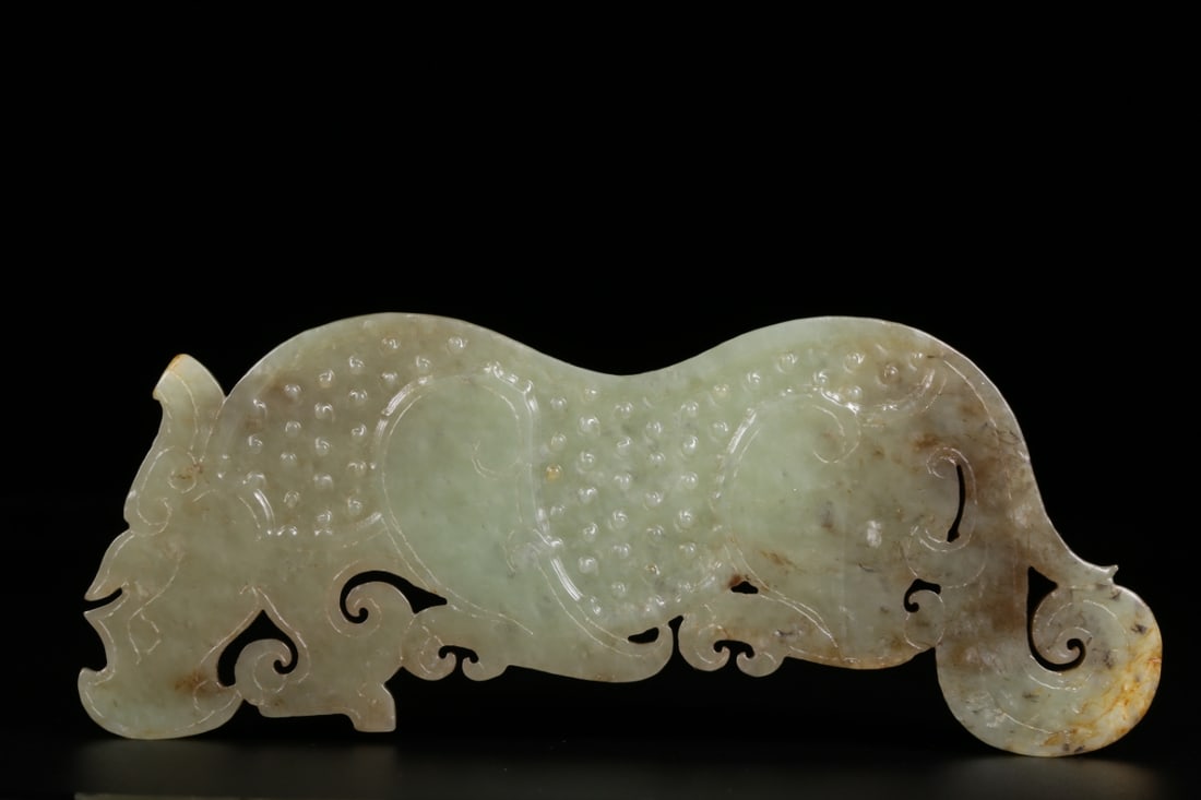A Exquisite Gaogu Jade Rhinoceros Pendant: A Exquisite Gaogu Jade Rhinoceros Pendant,Han Dynasty, China,Size:5.7inx2.1inx0.3in,Weight:113g 高古玉犀牛玉佩,中国汉代