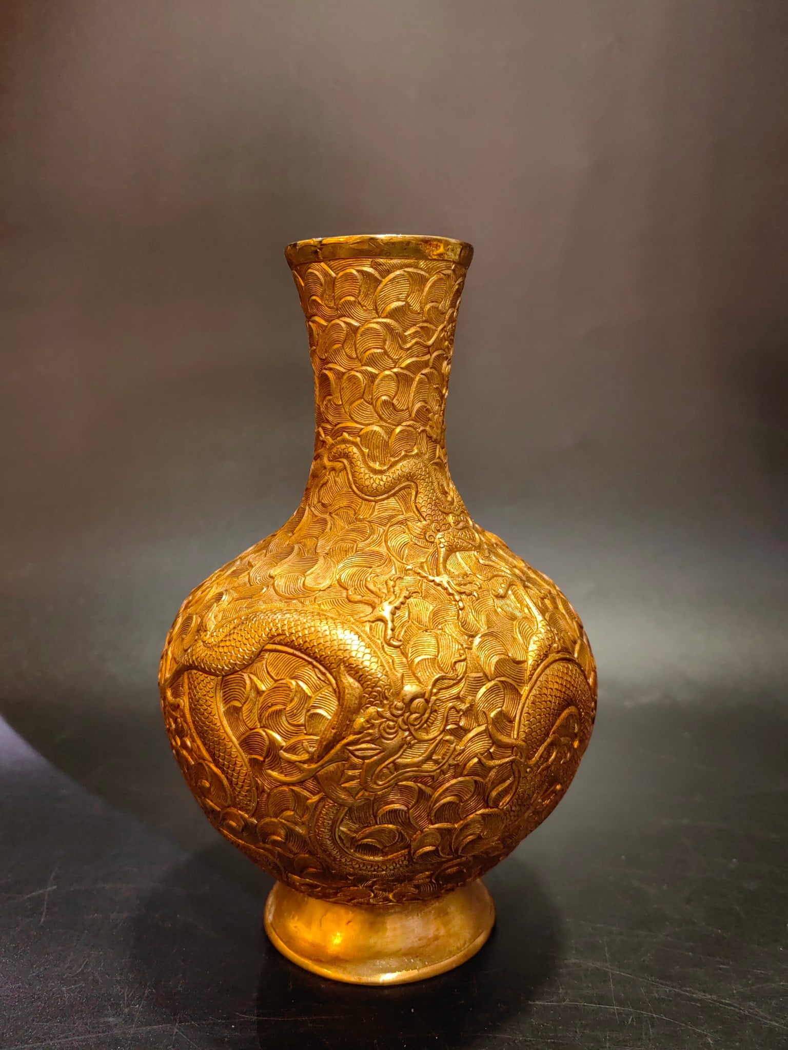 A Exquisite Gilt Bronze Seawater Pattern Dragon Vase: A Exquisite Gilt Bronze Seawater Pattern Dragon Vase,Qing Dynasty, China,Qianlong Four-character Mark,Size:4.7inx4.7inx7.3in,Weight:1434g 铜鎏金海水龙纹ல