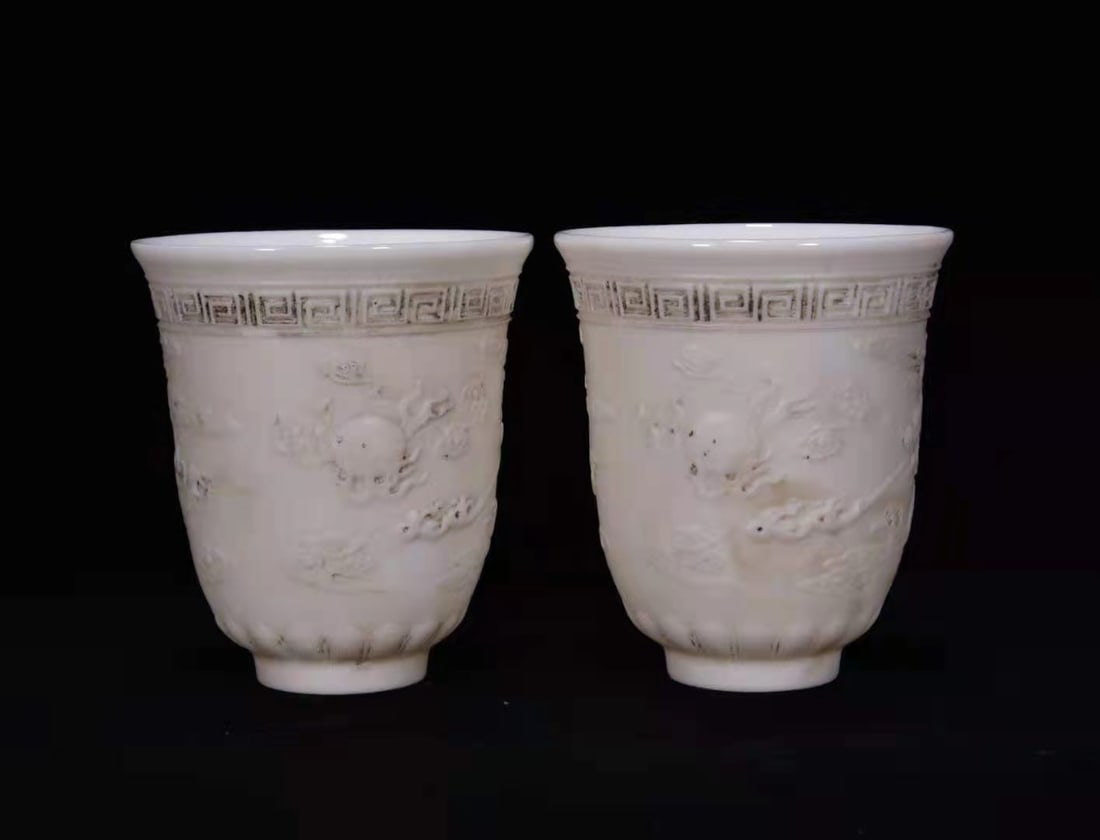 A pair of Exquisite Sweet white glaze Dragon pattern Cup: A pair of Exquisite Sweet white glaze Dragon pattern Cup,Qing Dynasty, China,Size:3.1inx2.8in 一对甜白釉龙纹杯,中国清代