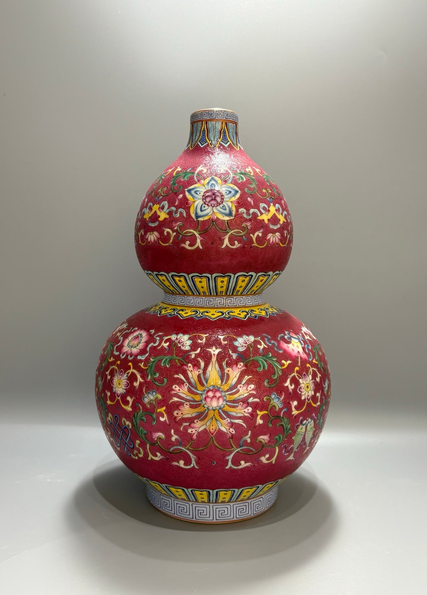A Exquisite Ruby Red Ground Eight Treasures Lotus Pattern Gourd-Shaped Vase: A Exquisite Ruby Red Ground Eight Treasures Lotus Pattern Gourd-Shaped Vase,Qing Dynasty, China,Qianlong Six-character Mark,Size:12.8inx8.1in 胭脂红地八宝缠&#