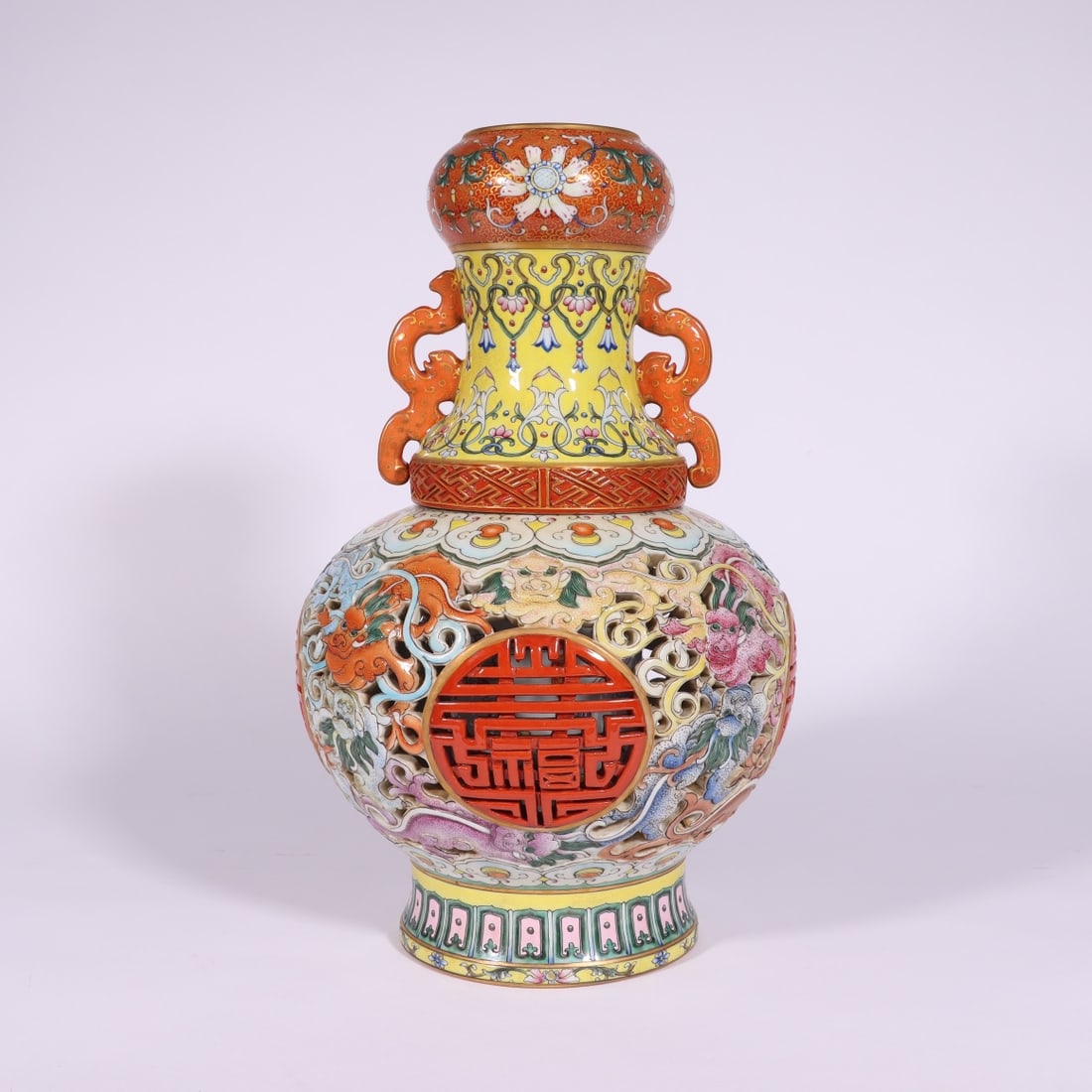 A Exquisite Famille-Rose Hollow Dragon Pattern Dragon-Ears Vase: A Exquisite Famille-Rose Hollow Dragon Pattern Dragon-Ears Vase,Qing Dynasty, China,Qianlong Six-character Mark,Size:13.4inx2.8inx5in 粉彩镂空龙纹龙耳&#