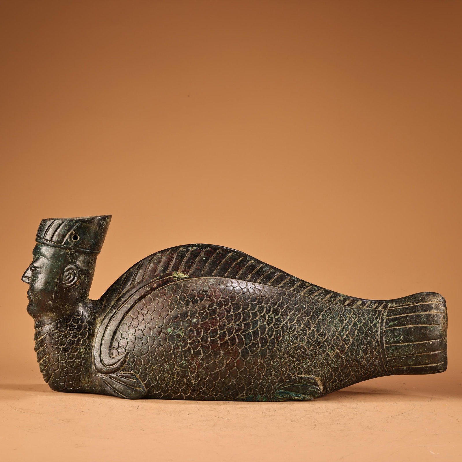 A Exquisite Bronze Human Face Fish Ornament: A Exquisite Bronze Human Face Fish Ornament,Ancient Time,China,Size:5.9inx13.4in,Weight:2200g 青铜人面鱼摆件,远古时期