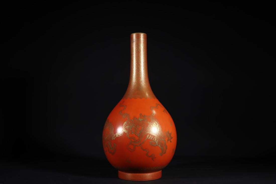 A Exquisite Coral Red Glaze Painted Gold Lion Pattern Vase: A Exquisite Coral Red Glaze Painted Gold Lion Pattern Vase,Qing Dynasty,China,Qianlong Six-character Mark,Size:13.6inx6.7in 珊瑚红釉描金狮纹瓶,