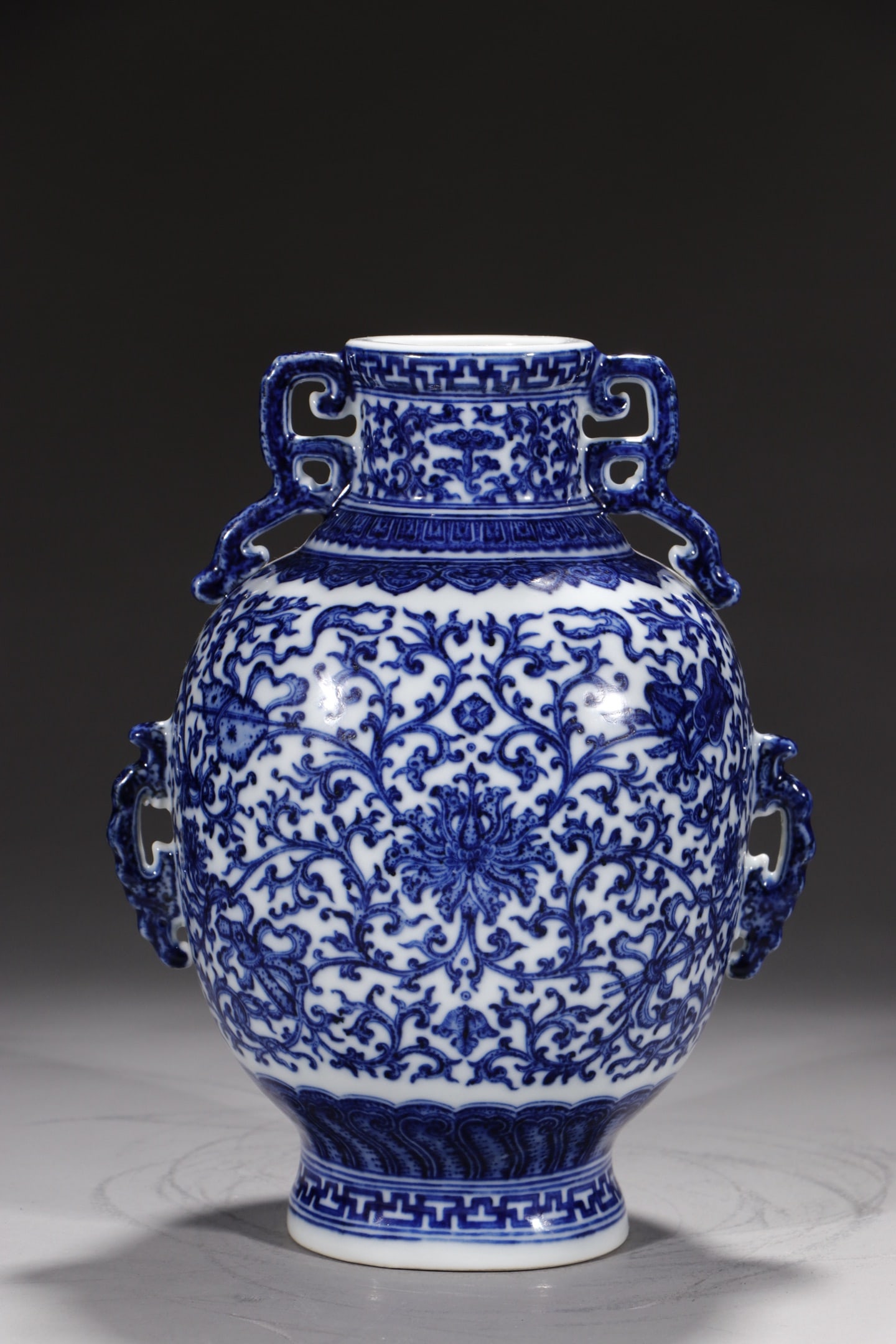 An Exquisite Blue and White Lotus Pattern Eight Treasures Pattern Double-Ears Vase: An Exquisite Blue and White Lotus Pattern Eight Treasures Pattern Double-Ears Vase Qing Dynasty, China Qianlong Six-character Mark Size:9.6in青花暗八仙缠枝