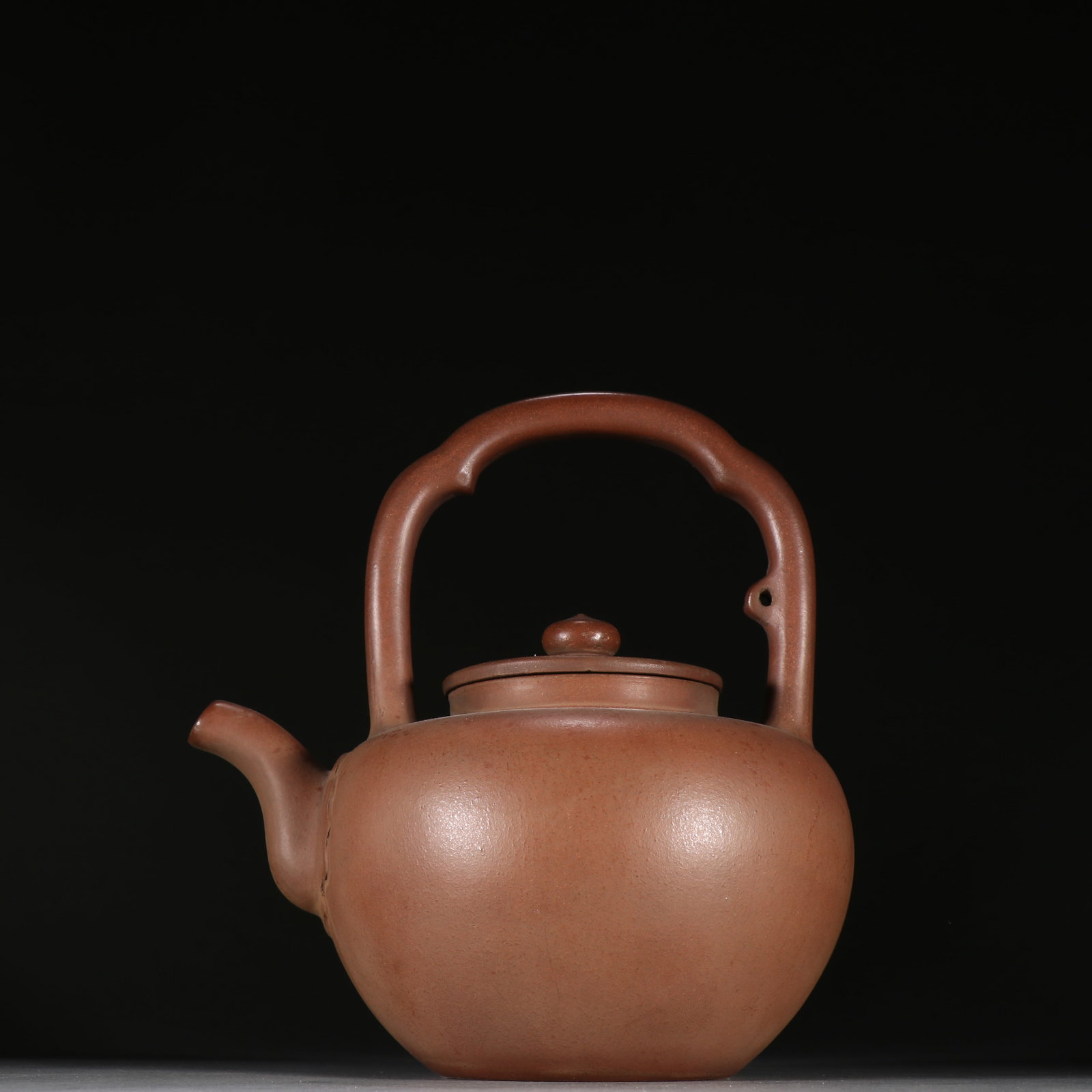 An Exquisite Purple Sands Ewer: An Exquisite Purple Sands Ewer Ming Dynasty, China Size:7.3inx6.7in紫砂提梁壶 中国明代 Size:18.5cmx17cm