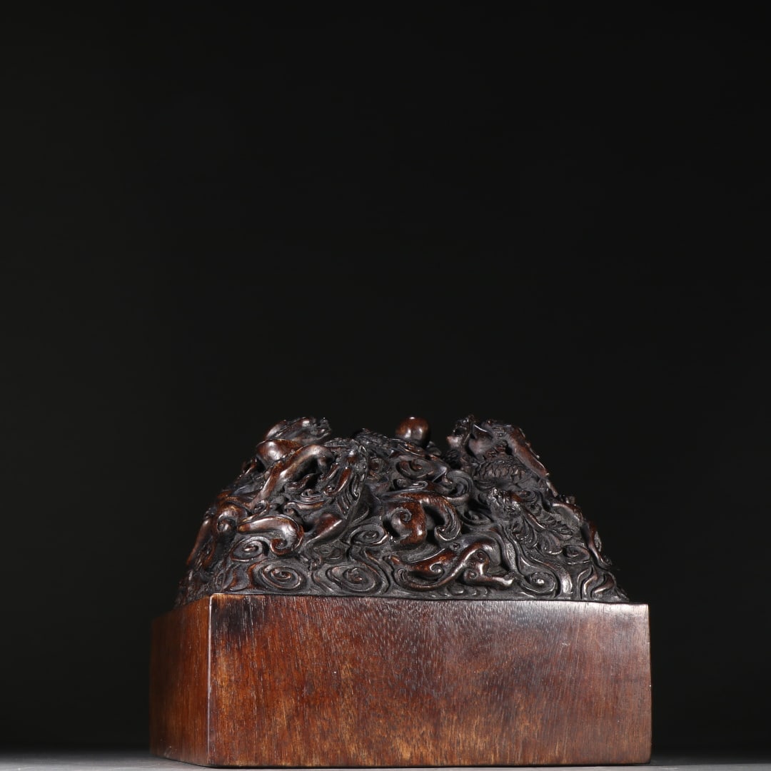 An Exquisite Eaglewood Dragon Pattern Seal: An Exquisite Eaglewood Dragon Pattern Seal Qing Dynasty, China Size:5.3inx6.1in Weight:700g沉香九龙钮印章 中国清代 Size:13.5cmx15.5cm
