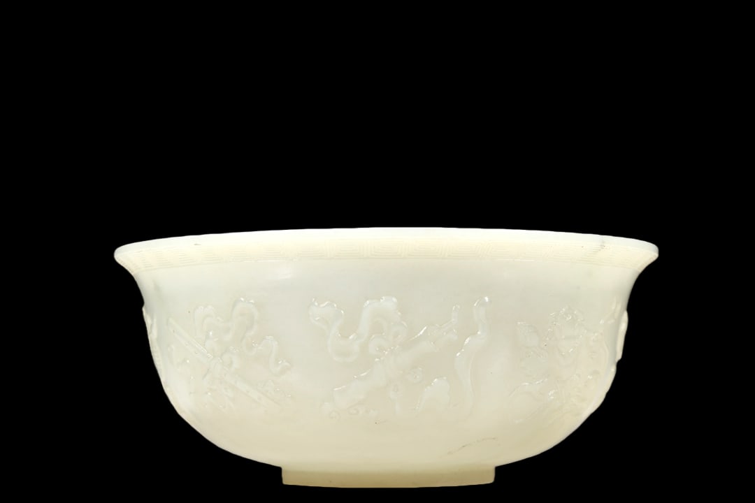 A Marvelous White Jade 'Weapons Of The Eight Immortals' Bowl: A Marvelous White Jade 'Weapons Of The Eight Immortals' Bowl. Chinese Qing Dynasty. Qianlong Four-Character Mark. Size:5.1inx2.2in. Weight:190g清代 乾隆年制 白