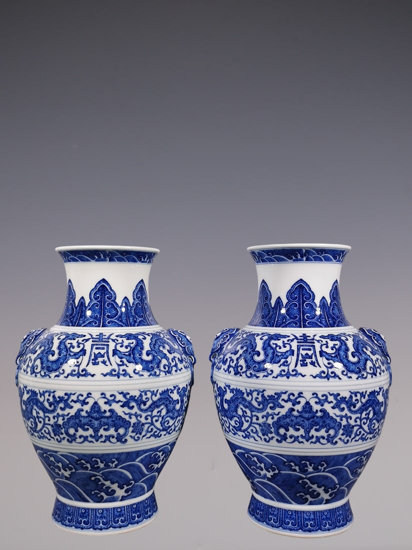 An Exquisite Blue and White Lotus Pattern Dragon Pattern Bats and Peach Pattern Seawater Pattern: An Exquisite Blue and White Lotus Pattern Dragon Pattern Bats and Peach Pattern Seawater Pattern Double-Ears Vase Qing Dynasty, China Yongzheng Six-character Mark Size:11.8inx7.7in青花 