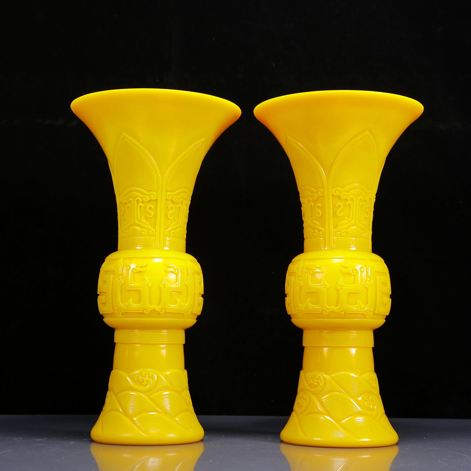 A Pair of Exquisite Glass Yellow Glazed Dragon Pattern Vases: A Pair of Exquisite Glass Yellow Glazed Dragon Pattern Vases,Qing Dynasty, China,Size:8.3inx16.1in,Weight:6340g 一对琉璃黄釉龙纹瓶，清