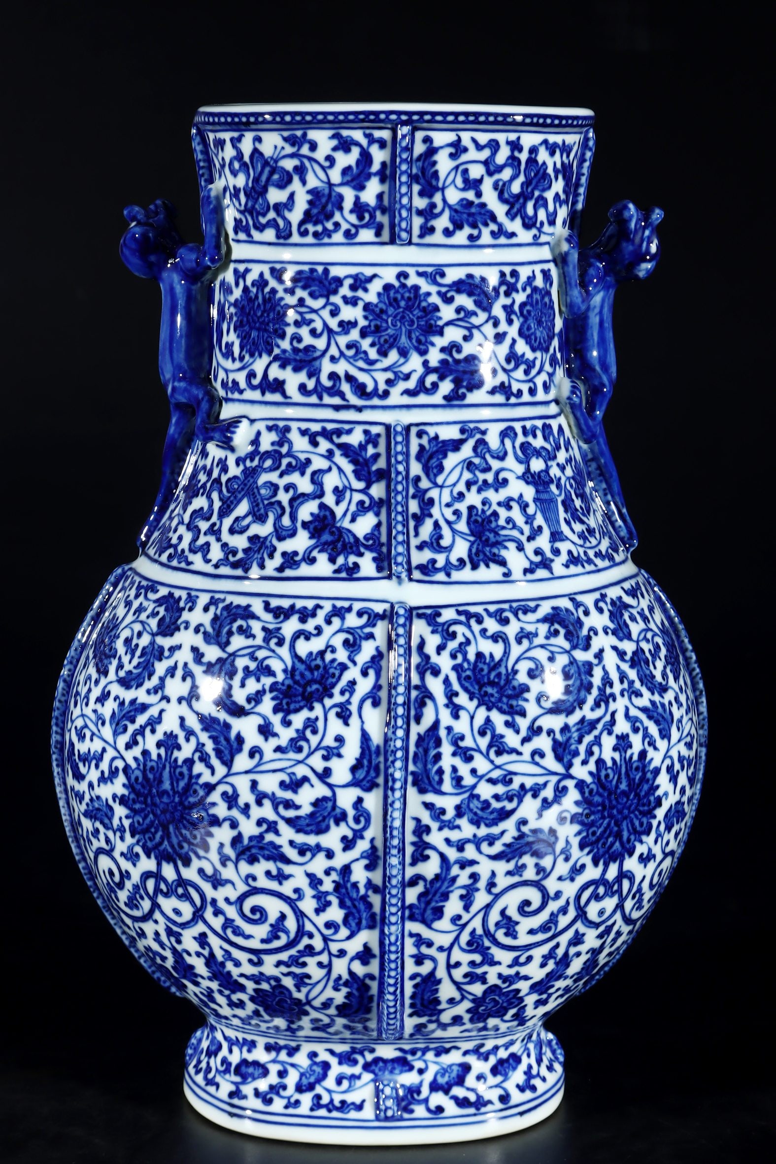 A Rare Blue and White Lotus Pattern Double-Ears Vase: A Rare Blue and White Lotus Pattern Double-Ears Vase,Qing Dynasty,China,Qianlong Six-character Mark,Size:13.4inx8.7in 青花缠枝莲纹双耳瓶,中&