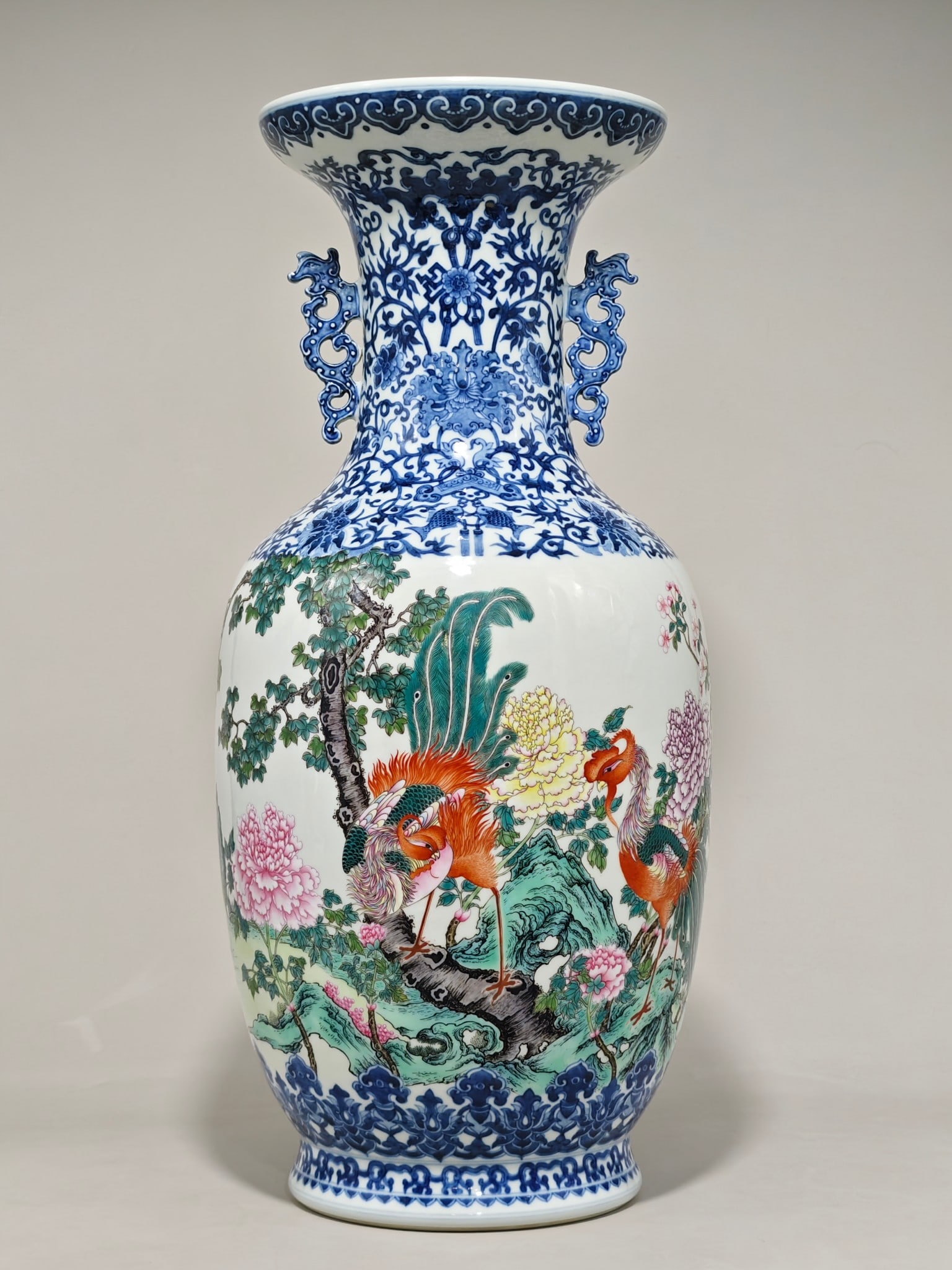 A Huge Blue and White Famille-Rose Flower and Peacock Pattern Double-Ears Vase: A Huge Blue and White Famille-Rose Flower and Peacock Pattern Double-Ears Vase,Qing Dynasty,China,Qianlong Six-character Mark,Size:21.4inx9.4in 青花粉彩花卉孔