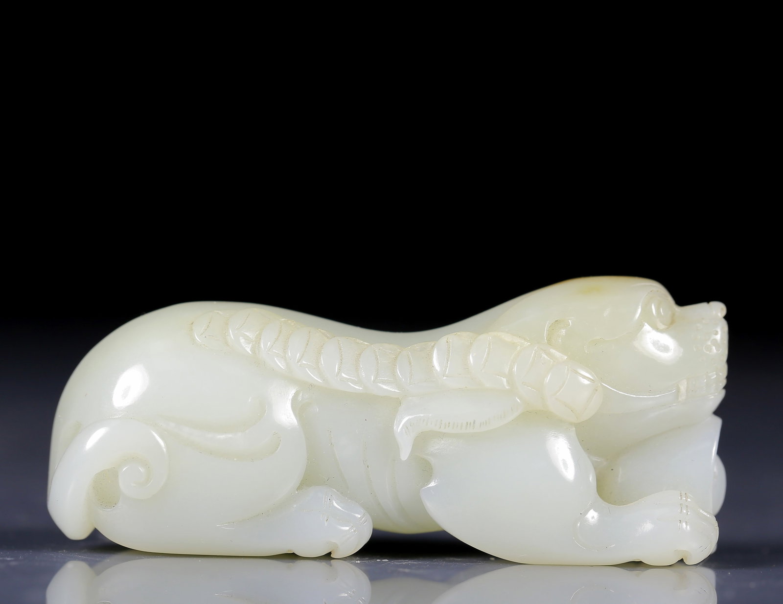 An Exquisite White Jade Dog Pendant: An Exquisite White Jade Dog Pendant,Qing Dynasty, China,Size:2.6inx0.8inx1.2in,Weight:50g 白玉狗挂件，清代