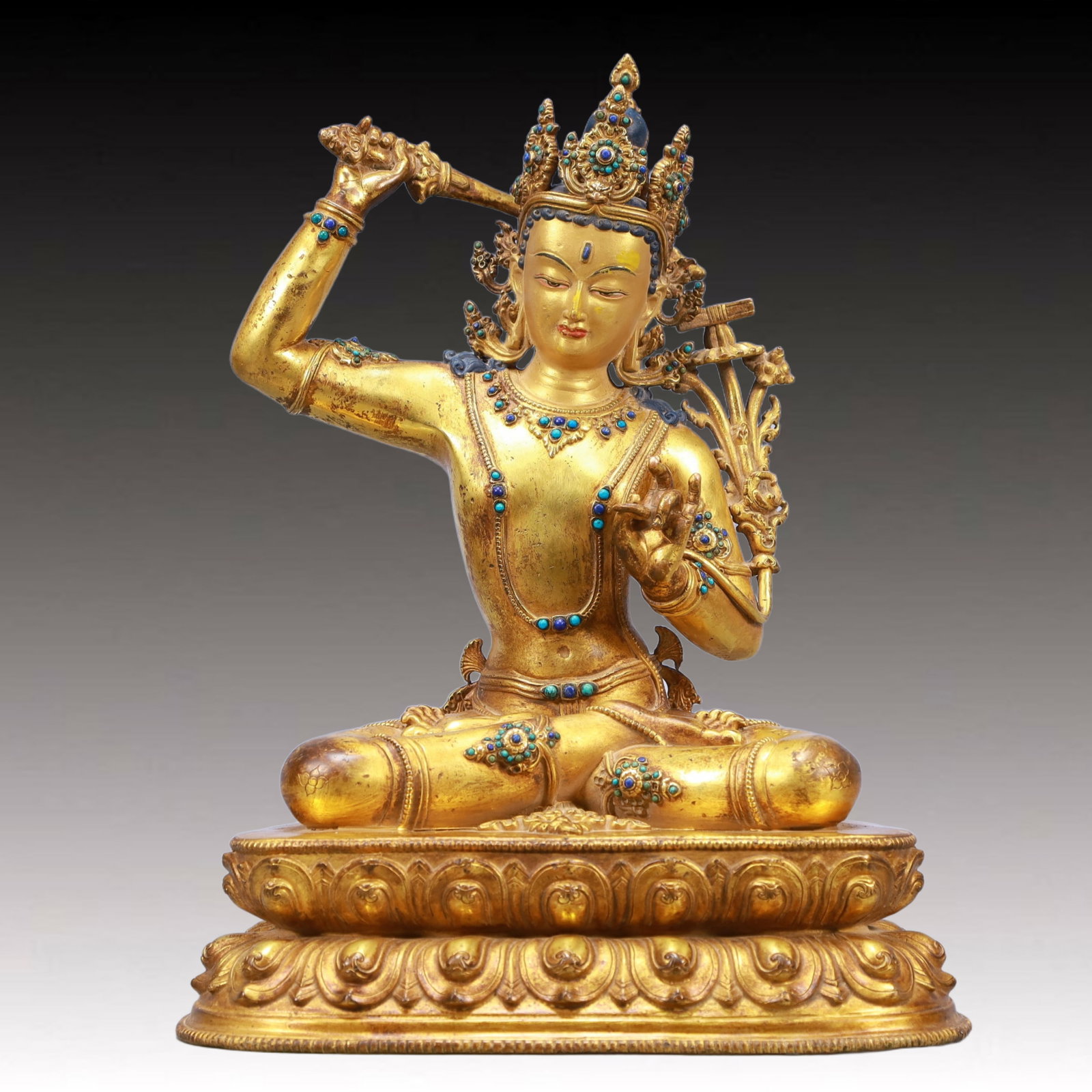 A Solemn Gilt Bronze Inlaid Gems Statue of Manjusri: A Solemn Gilt Bronze Inlaid Gems Statue of Manjusri,Ming Dynasty, China,Size:9.8inx6.3inx13in Weight:4700g 铜鎏金嵌宝石文殊菩萨像,