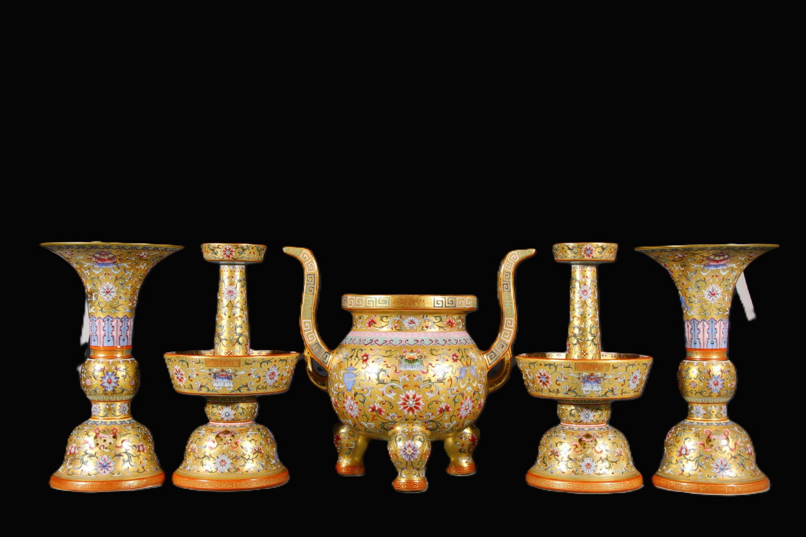 A Set of Fine Yellow Ground Enamel Lotus Pattern Ornaments: A Set of Fine Yellow Ground Enamel Lotus Pattern Ornaments,Qing Dynasty,China,Qianlong Six-character Mark,Size:(Censer)10.6inx6.3in,(Candlestick)11.4inx5.1in,(Vase)10.6inx6.3in 一套黄