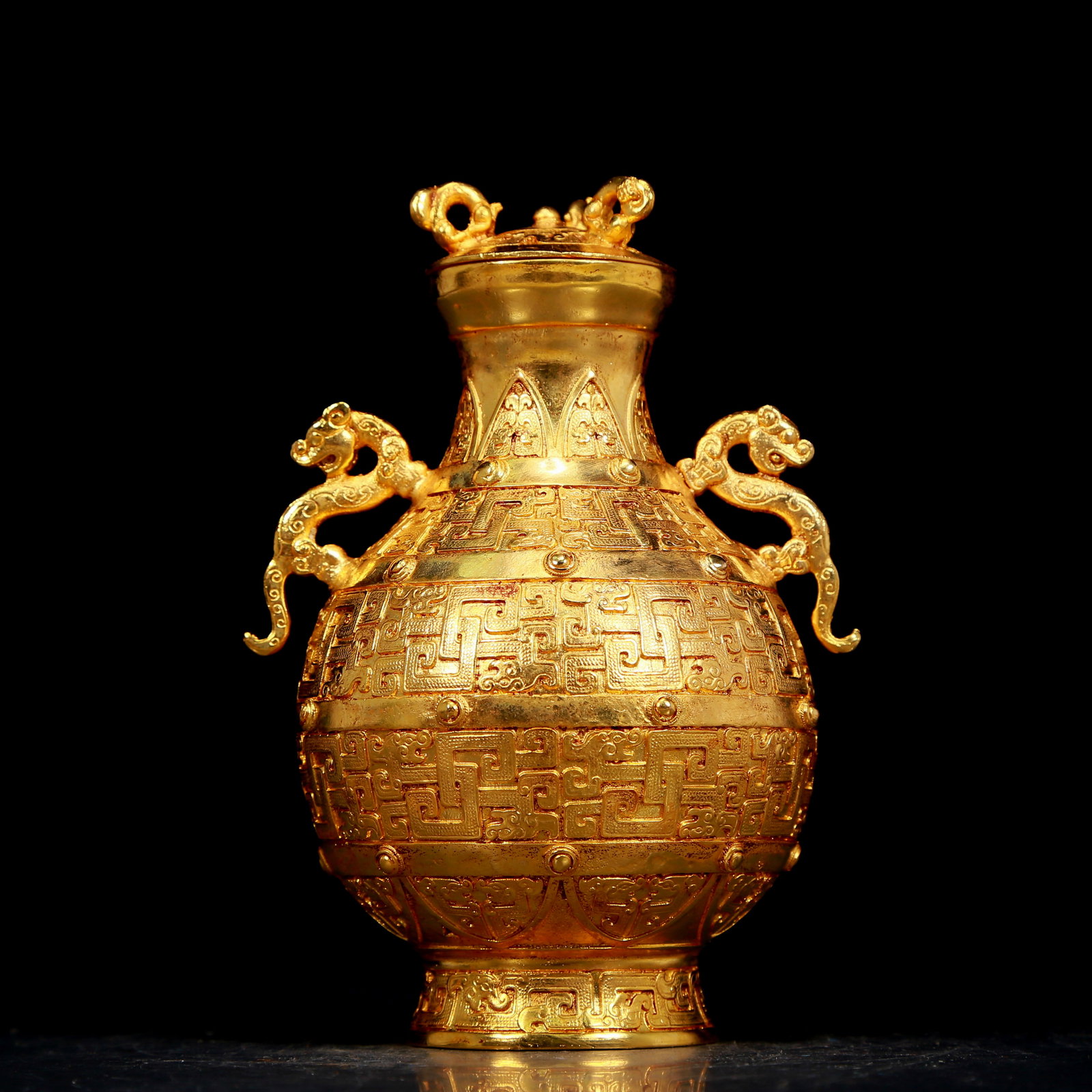 An exquisite gilt bronze vase with double ears and auspicious animal patterns: An exquisite gilt bronze vase with double ears and auspicious animal patterns, Qing Dynasty, China, four-character Qianlong designation. The surface has been carefully carved, vividly demonstrating