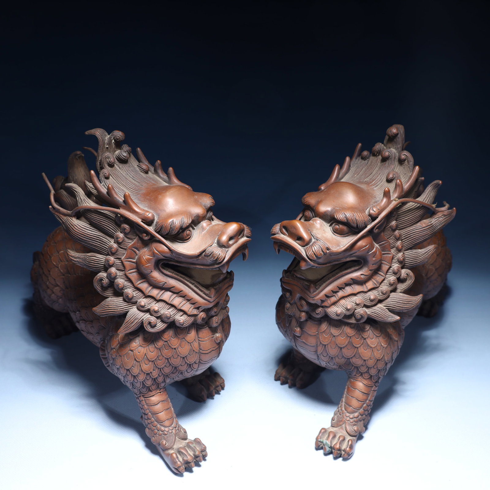 A Pair of Exquisite Bronze Kylin Ornaments: A Pair of Exquisite Bronze Kylin Ornaments,Qing Dynasty,China,Size:7.9inx3.9inx8.7in,Weight:8650g 一对铜麒麟摆件,中国清代