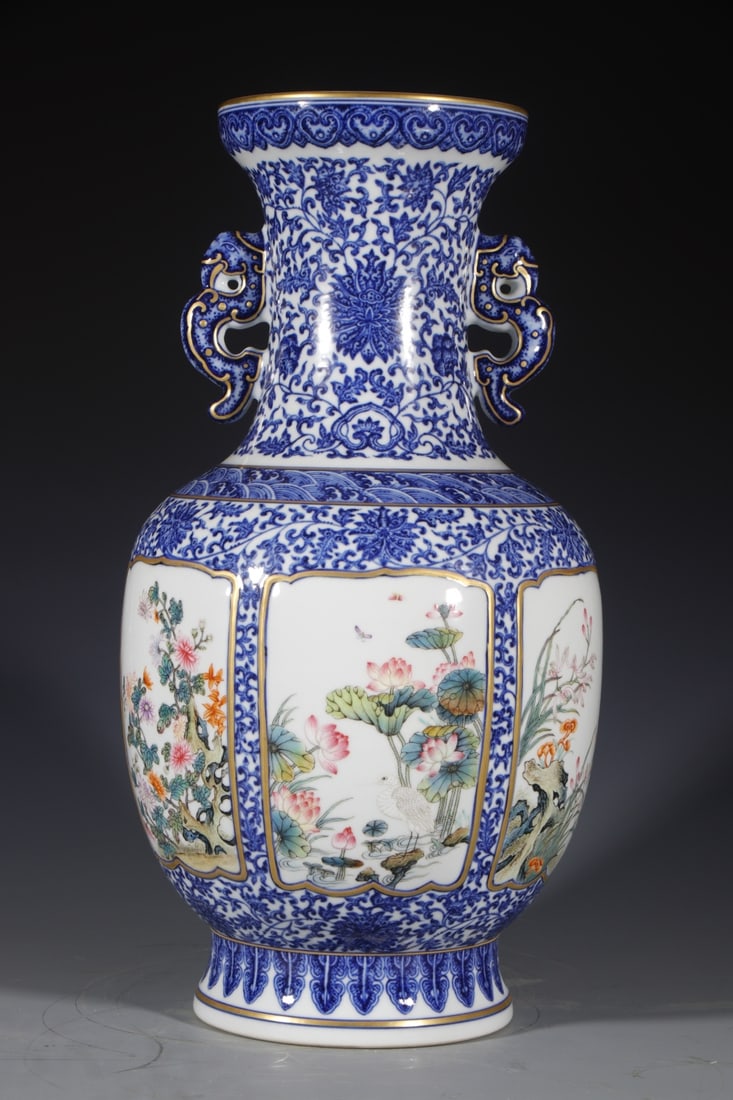 A Huge Blue and White Flower and Bird Pattern Double-Ears Vase: A Huge Blue and White Flower and Bird Pattern Double-Ears Vase,Qing Dynasty,China,Qianlong Six-character Mark,Size:17.3inx6.3in 青花花鸟纹双耳瓶,中