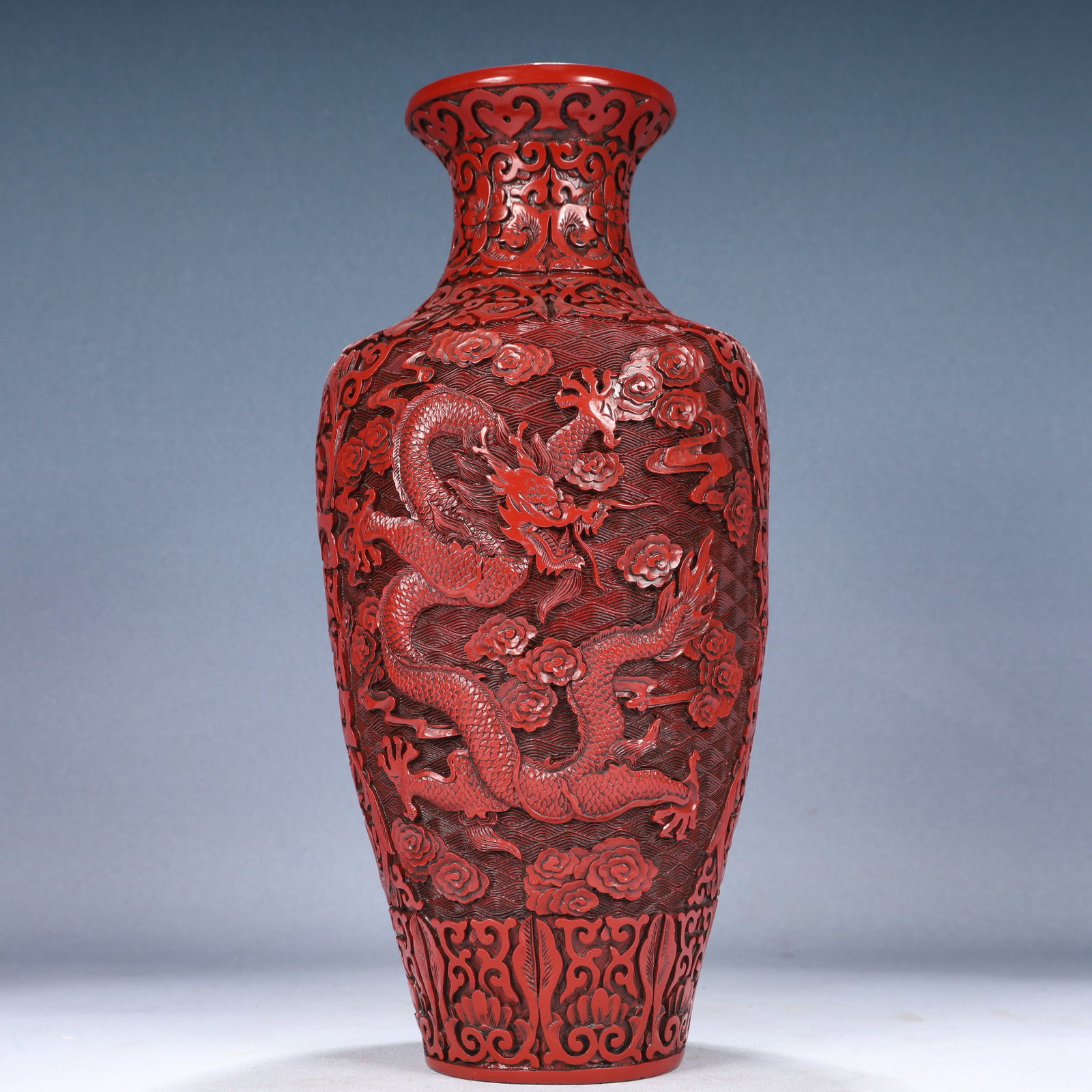 A Rare Carved Red Lacquer Seawater,Auspicious Cloud and Dragon Pattern Vase: A Rare Carved Red Lacquer Seawater,Auspicious Cloud and Dragon Pattern Vase,Qing Dynasty, China,Qianlong Six-character Mark,Size:6.7inx15in,Weight:1550g 剔红漆海水祥