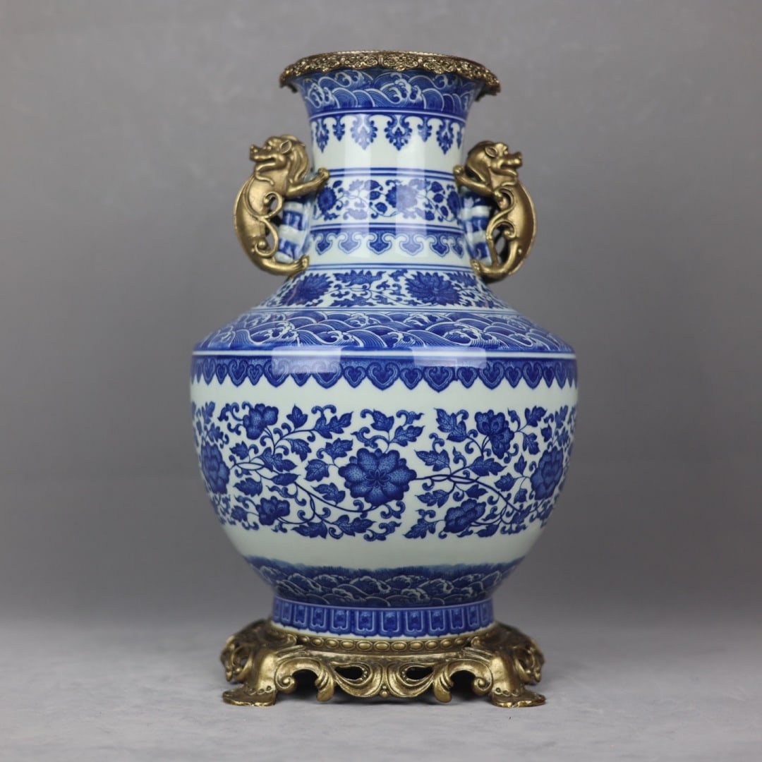 A Rare Blue and White Inlaid Bronze Lotus Pattern Double-Ears Vase: A Rare Blue and White Inlaid Bronze Lotus Pattern Double-Ears Vase,Qing Dynasty,China,Qianlong Six-character Mark,Size:15inx8.7in 青花镶铜缠枝莲纹ࡡ