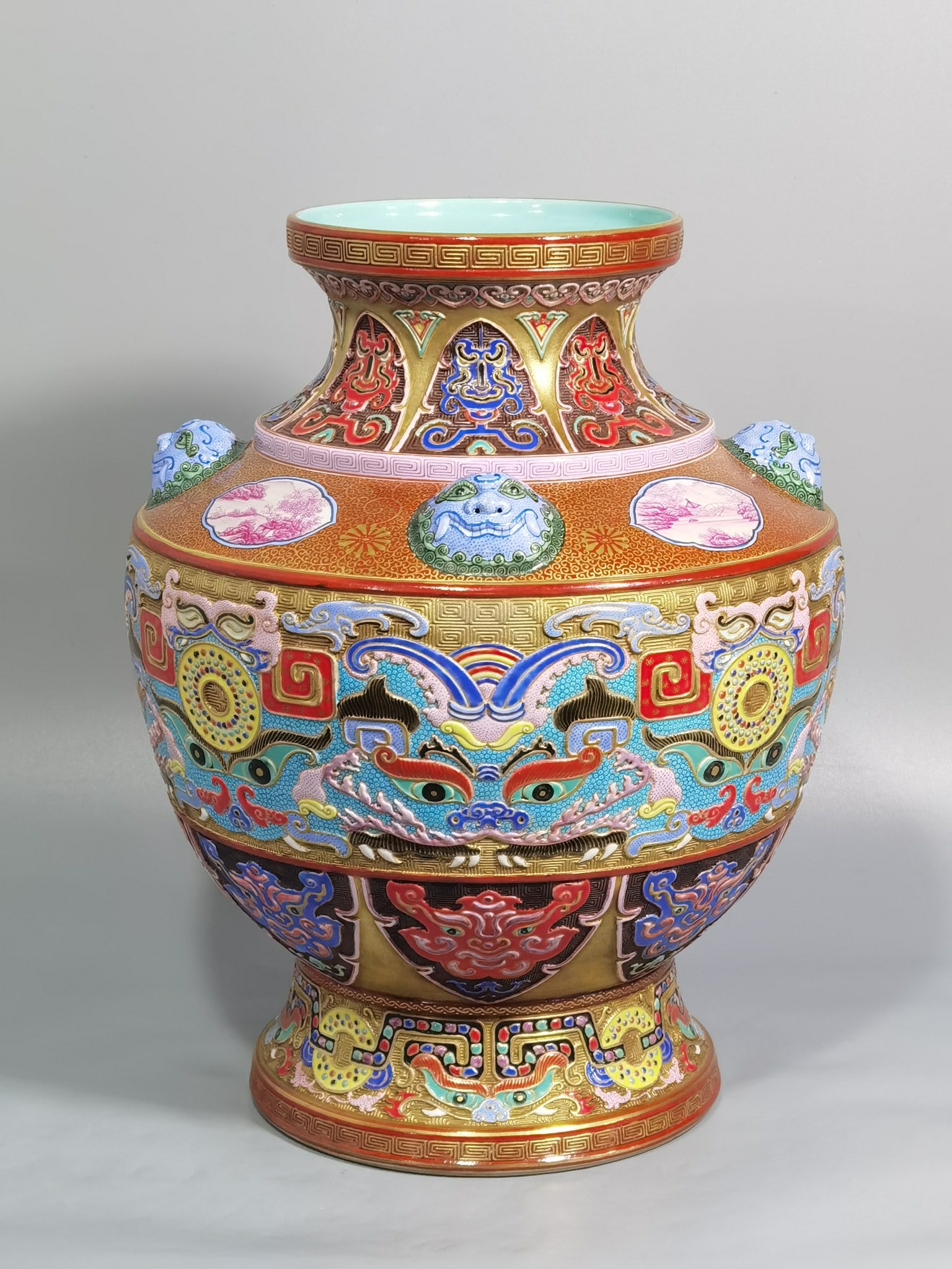 An Exquisite Enamel Gold Ground Beast-Face Pattern Beast-Ears Vase: An Exquisite Enamel Gold Ground Beast-Face Pattern Beast-Ears Vase,Qing Dynasty,China,Qianlong Six-character Mark,Size:10.7inx8.5in 珐琅彩金地兽面纹