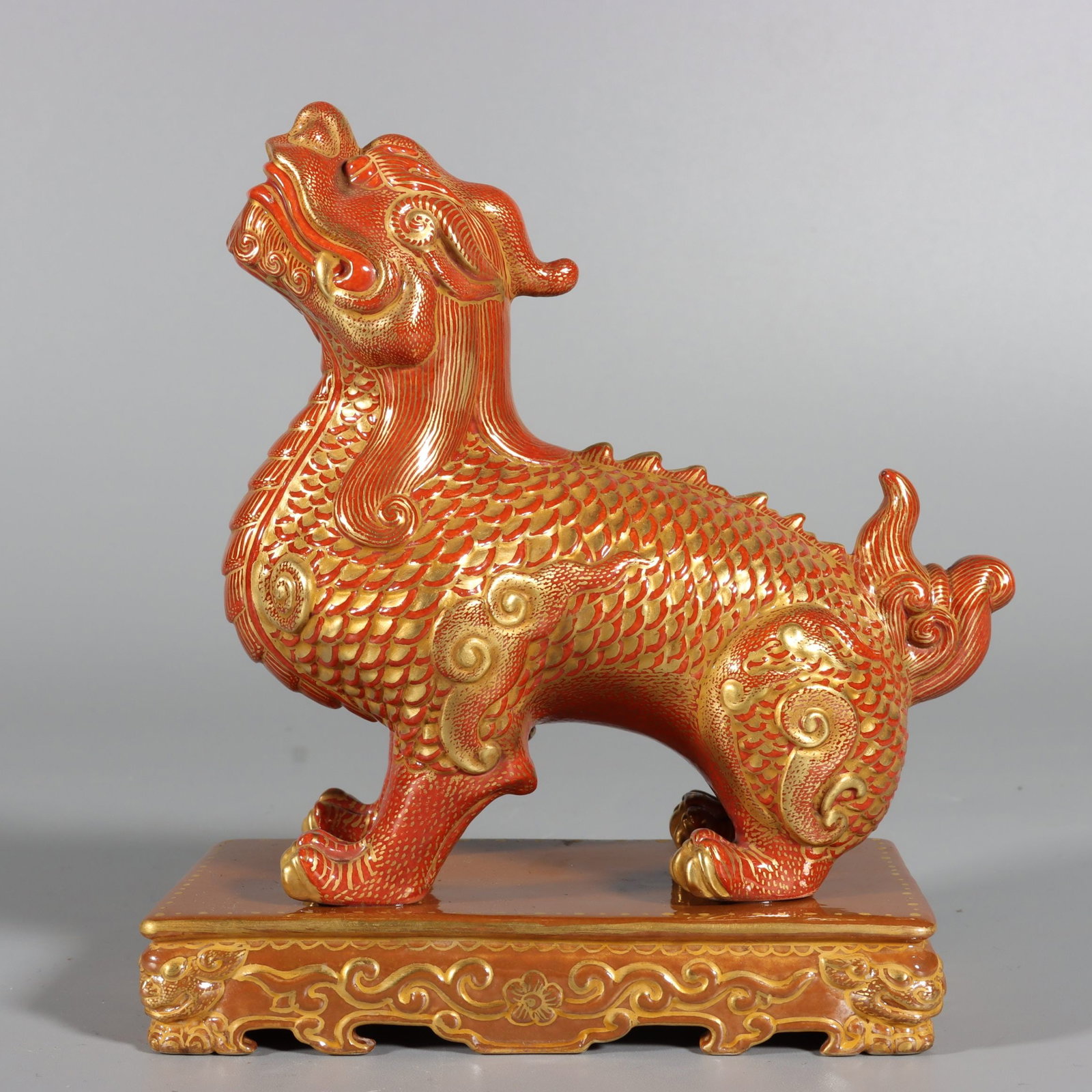 An Exquisite Red Glazed Painted Gold Kylin Ornament: An Exquisite Red Glazed Painted Gold Kylin Ornament,Qing Dynasty,China,Qianlong Six-character Mark,Size:5.7inx4.3inx2.3in 