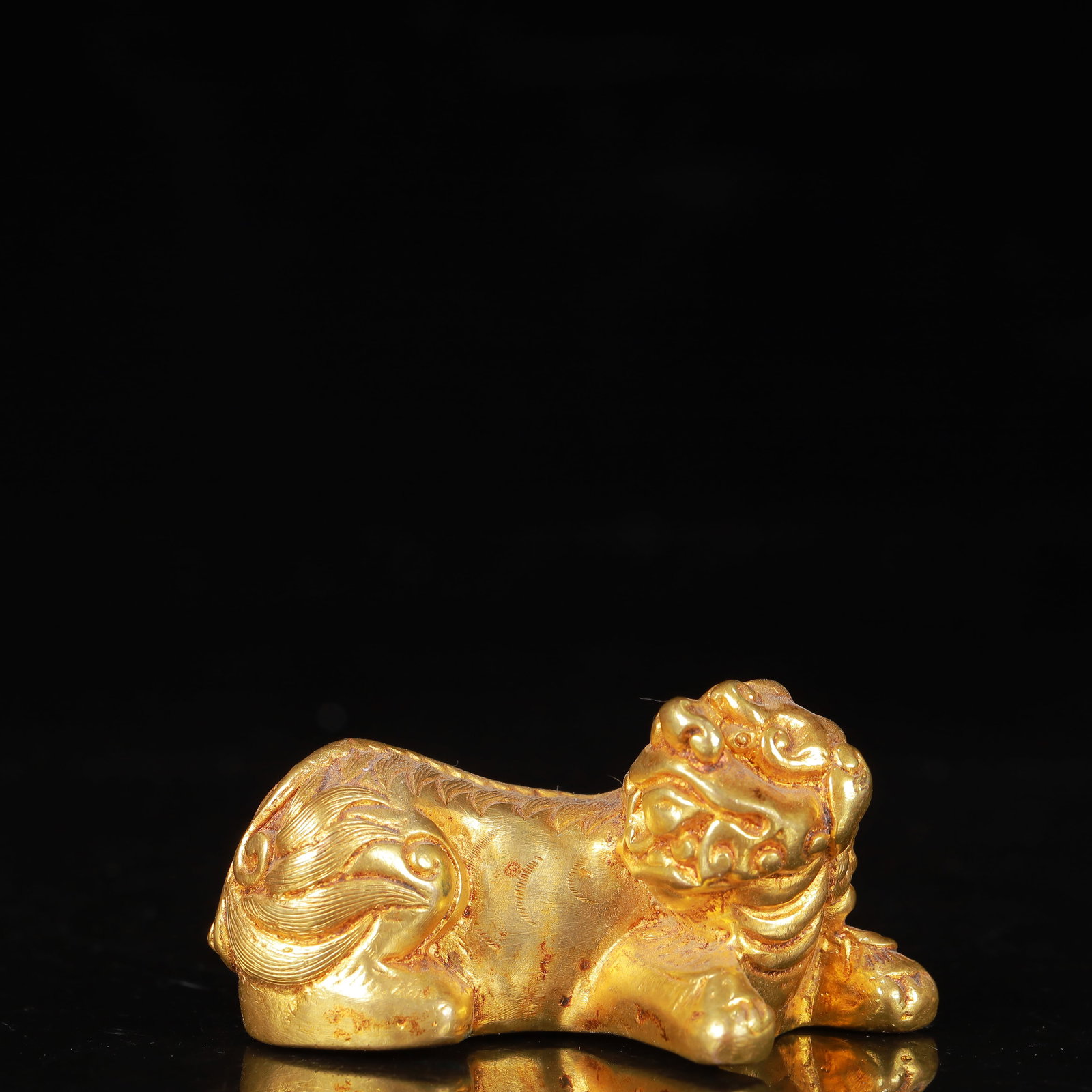 An Exquisite Gilt Bronze Auspicious Beast Ornament: An Exquisite Gilt Bronze Auspicious Beast Ornament,Qing Dynasty,China,Size:2.4inx1.2inx1.4in,Weight:178g 铜鎏金瑞兽摆件,中国清代