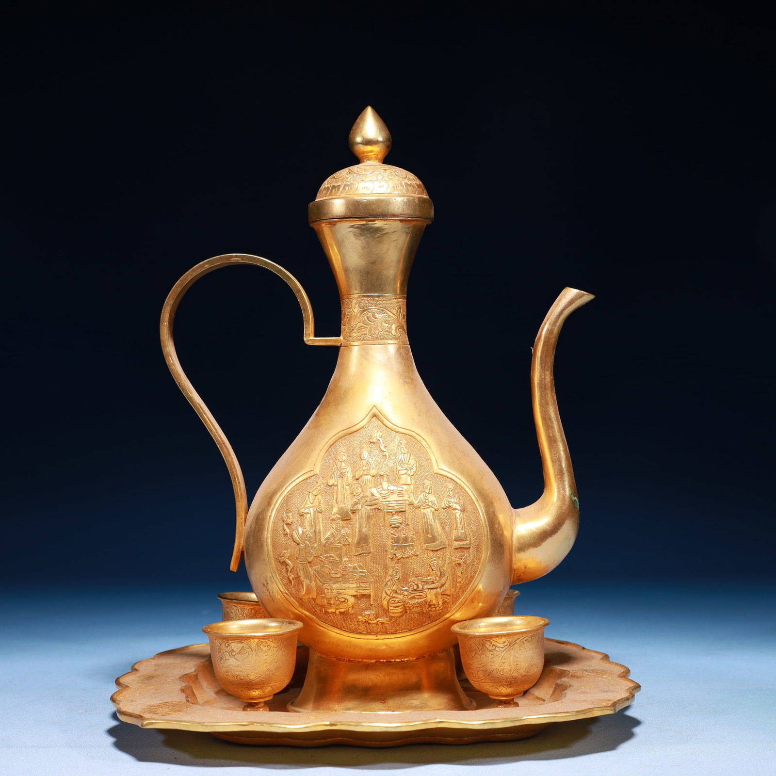 A Set of Gilt Bronze Character and Story Pattern Wine Sets: A Set of Gilt Bronze Character and Story Pattern Wine Sets,Tang Dynasty,China,Zhenguan Four-character Mark,Size:8.7inx8.3inx10.6in,Weight:1350g 一套铜鎏金人物