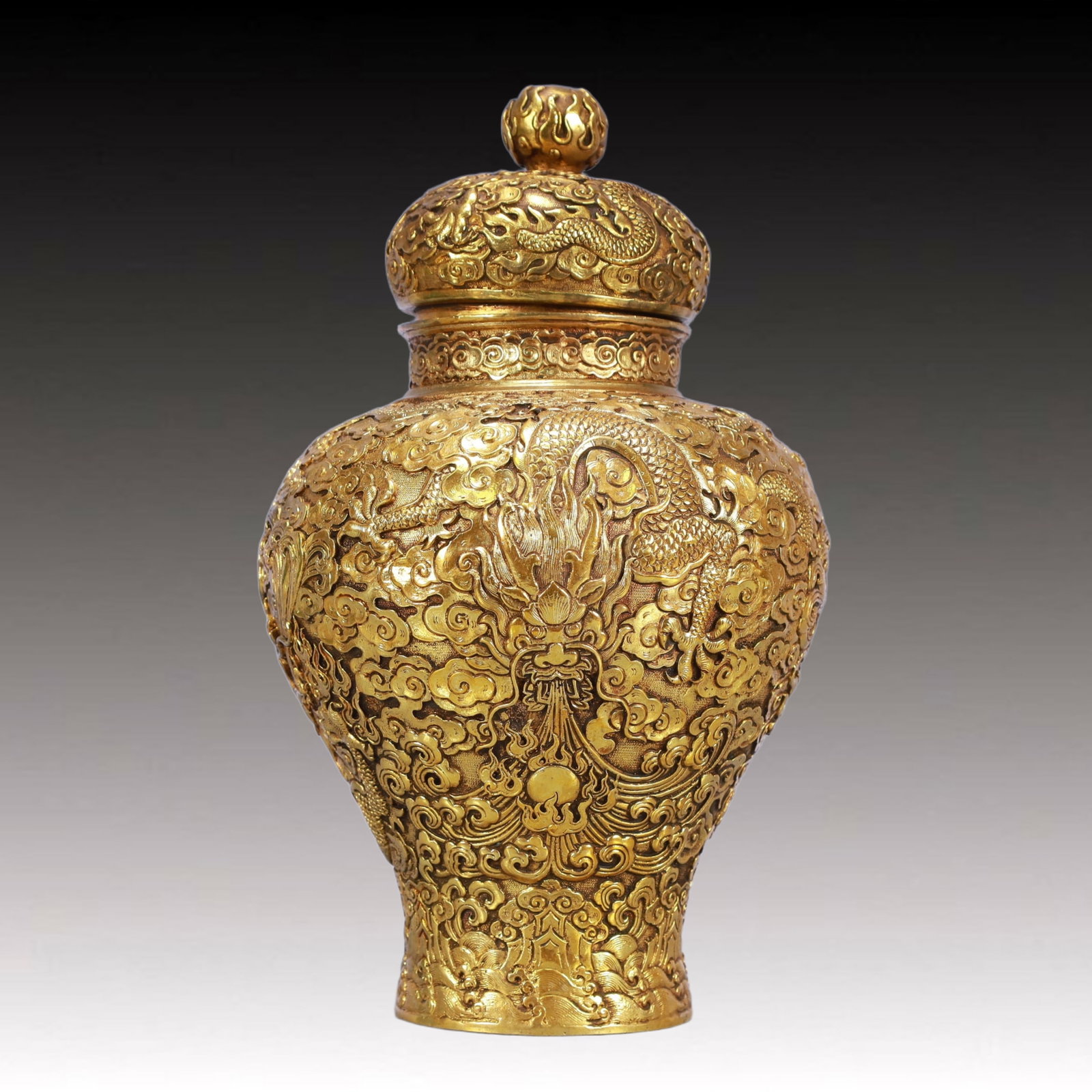 A Rare Gilt Bronze Auspicious Cloud and Dragon Pattern Cover Jar: A Rare Gilt Bronze Auspicious Cloud and Dragon Pattern Cover Jar,Qing Dynasty, China,Qianlong Six-character Mark,Size:6.7inx11.4in,Weight:2650g 铜鎏金祥云龙纹