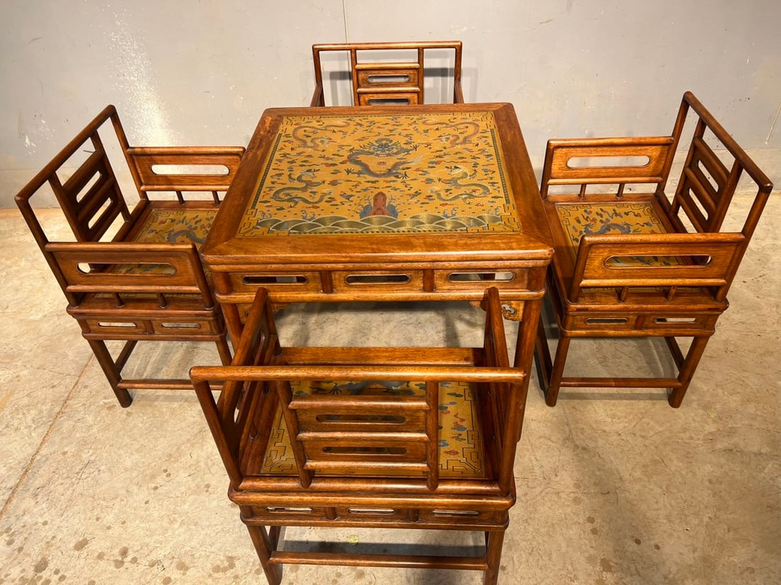 A Set of Huge Huanghuali wood Auspicious Cloud and Dragon Pattern Tables,with an Imperial Poem by: A Set of Huge Huanghuali wood Auspicious Cloud and Dragon Pattern Tables,with an Imperial Poem by Emperor Qianlong,Qing Dynasty, China,Size:(Table)35.4inx35.4inx31.9in,(Chair)25.6inx18.9inx34.3in 