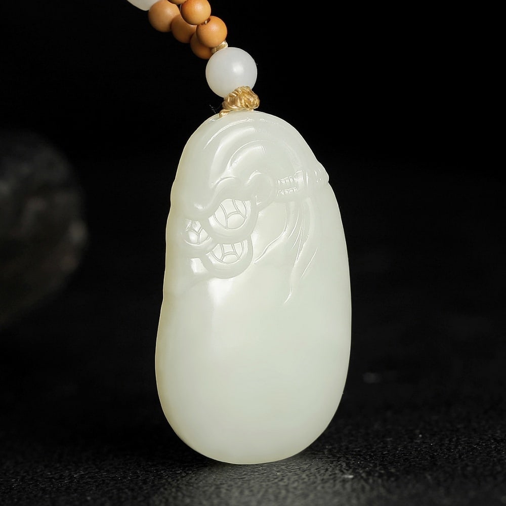 An Exquisite White Jade Pendant: An Exquisite White Jade Pendant,Size:1.7inx1inx0.3in 白玉挂件