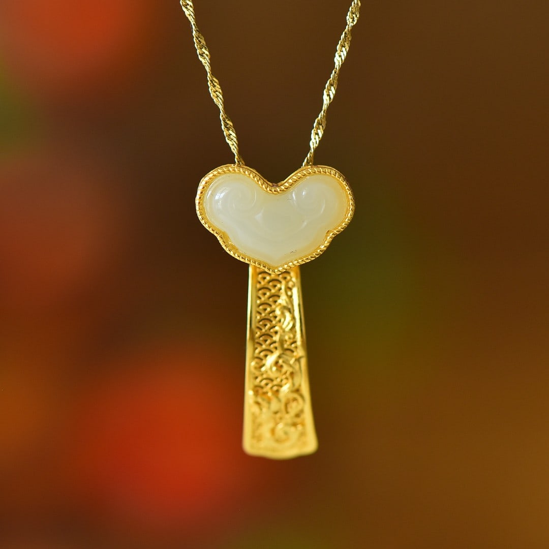 An Exquisite Sterling Silver-Gold Plated Inlaid White Jade Pendant: An Exquisite Sterling Silver-Gold Plated Inlaid White Jade Pendant,Size:0.4inx0.7in 纯银镀金镶白玉吊坠
