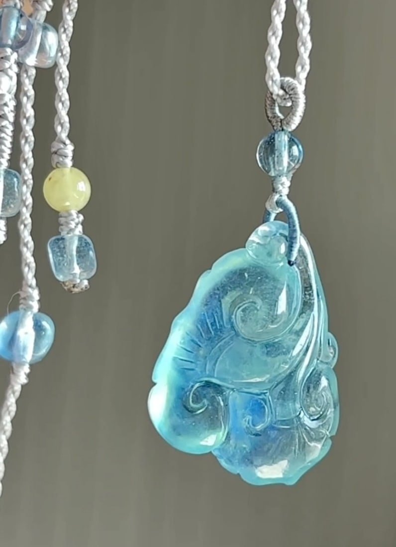 An Exquisite Aquamarine Ruyi Necklace: An Exquisite Aquamarine Ruyi Necklace,Size:1inx0.7inx0.4in,Weight:7.5g 海蓝宝如意吊坠