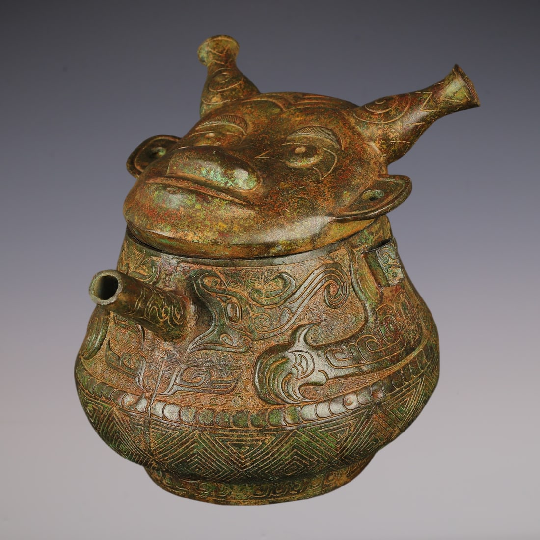 An Exquisite Bronze Beast-Face Pattern With Inscription Ewer: An Exquisite Bronze Beast-Face Pattern With Inscription Ewer W.Zhou , China Size:12.6inx9.8inx11in Weight:7300g青铜人面壶 西周时期 Size:32cmx25cmx
